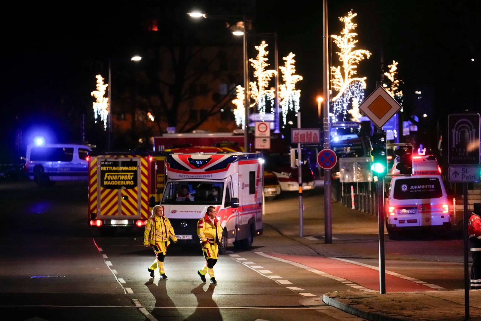 Emergency services work in a cordoned-off area near a Christmas Market, after a car drove into a crowd in Magdeburg, Germany, Saturday, Dec. 21, 2024. (AP Photo/Ebrahim Noroozi)