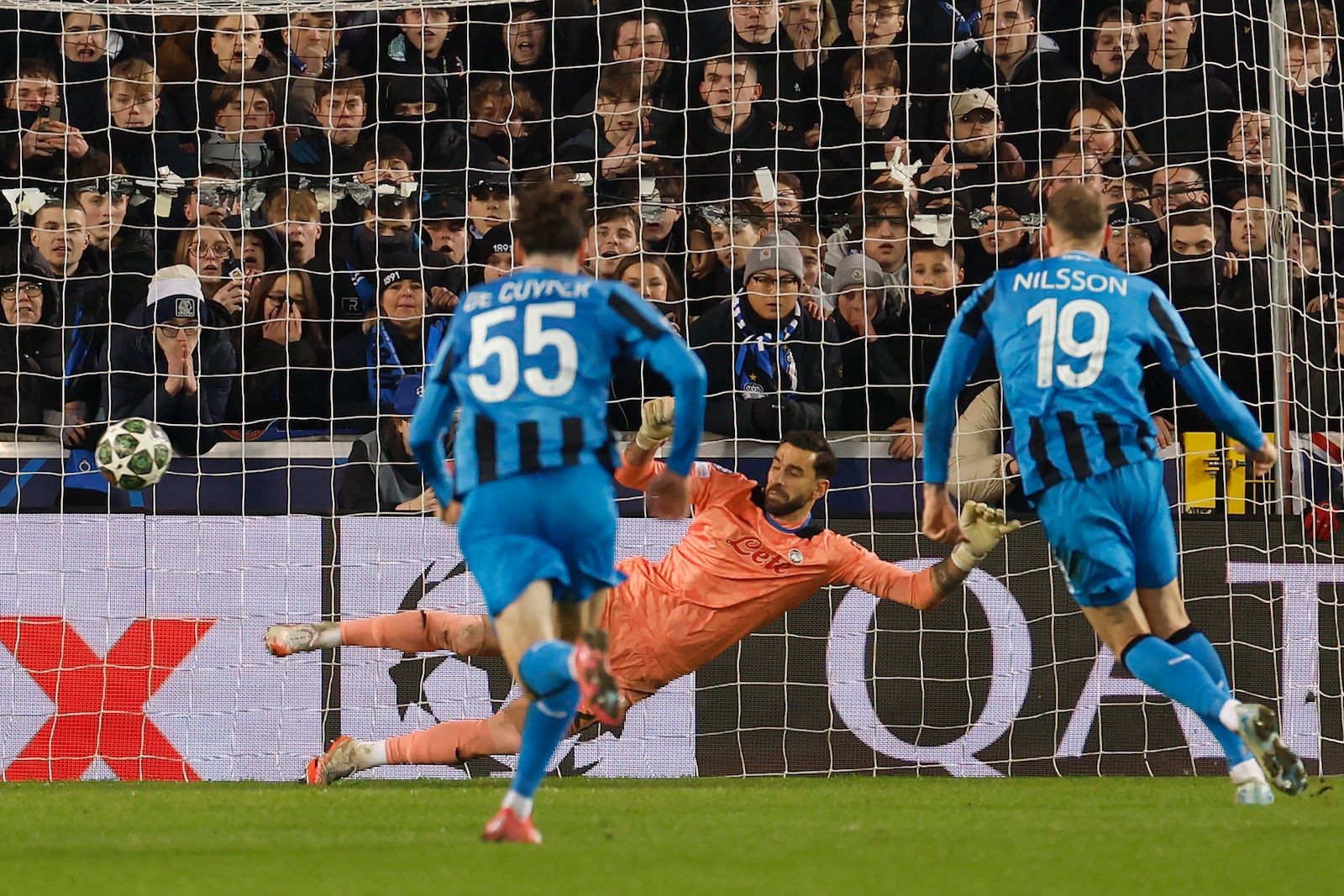 Brugge's Gustaf Nilsson, right, scores the second goal from penalty position against Atalanta, during the Champions League playoff first leg soccer match between Club Brugge and Atalanta at the Jan Breydel Stadium in Bruges, Belgium, Wednesday, Feb. 12, 2025. (AP Photo/Geert Vanden Wijngaert)