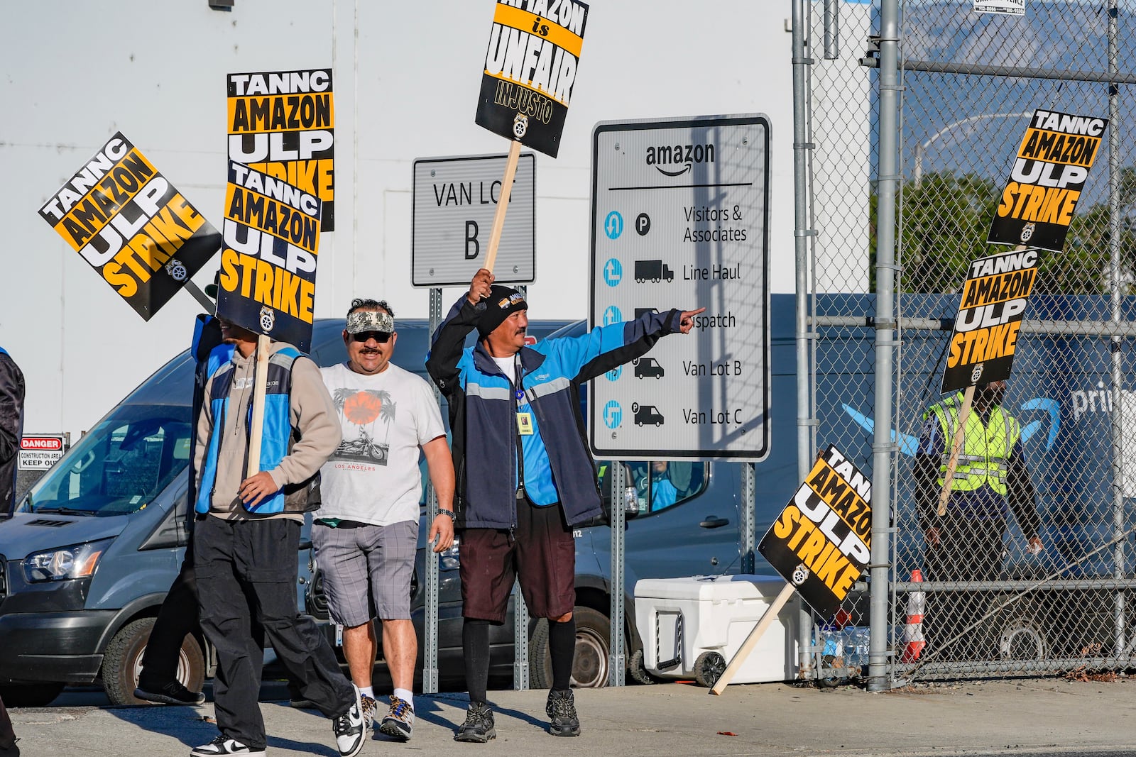 Amazon workers, on strike, picket outside an Amazon Fulfillment Center, Thursday, Dec. 19, 2024, in City of Industry, Calif. (AP Photo/Damian Dovarganes)