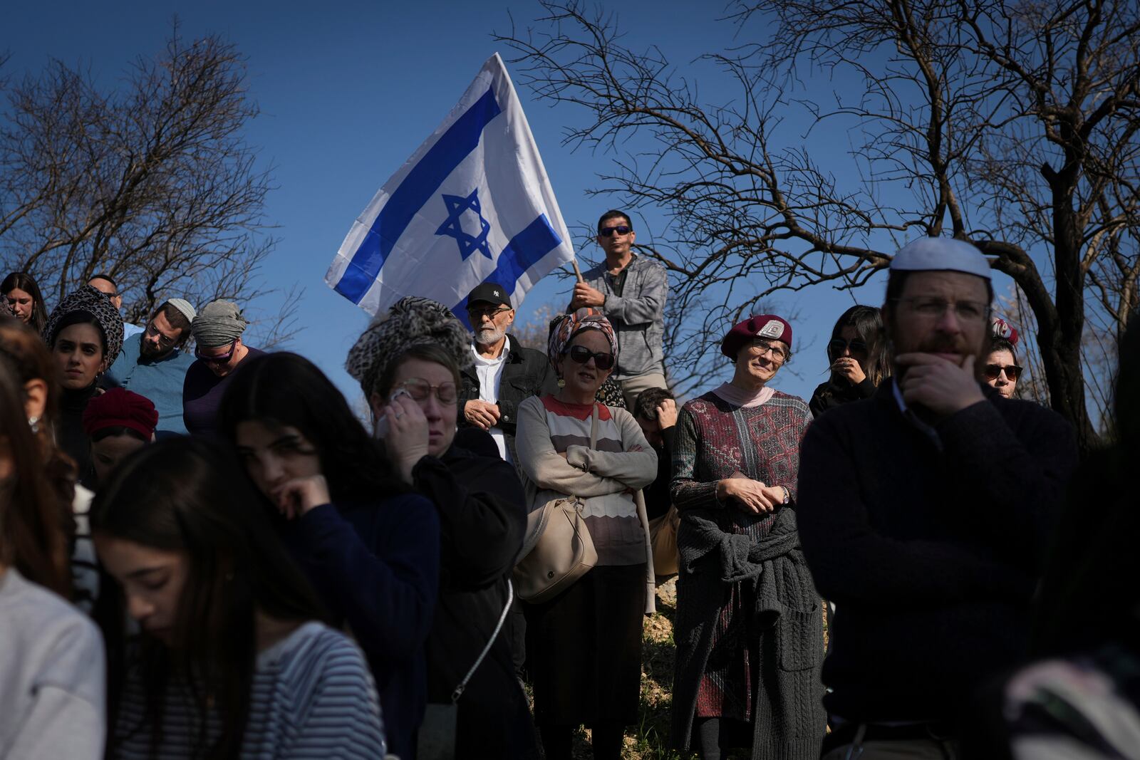 Mourners attend the funeral of Rachel Cohen, 73, and Aliza Raiz, 70, who were killed yesterday in a Palestinian shooting attack in the West Bank, at a cemetery in the West Bank Jewish settlement of Kdumim, Tuesday, Jan. 7, 2025. (AP Photo/Ohad Zwigenberg)