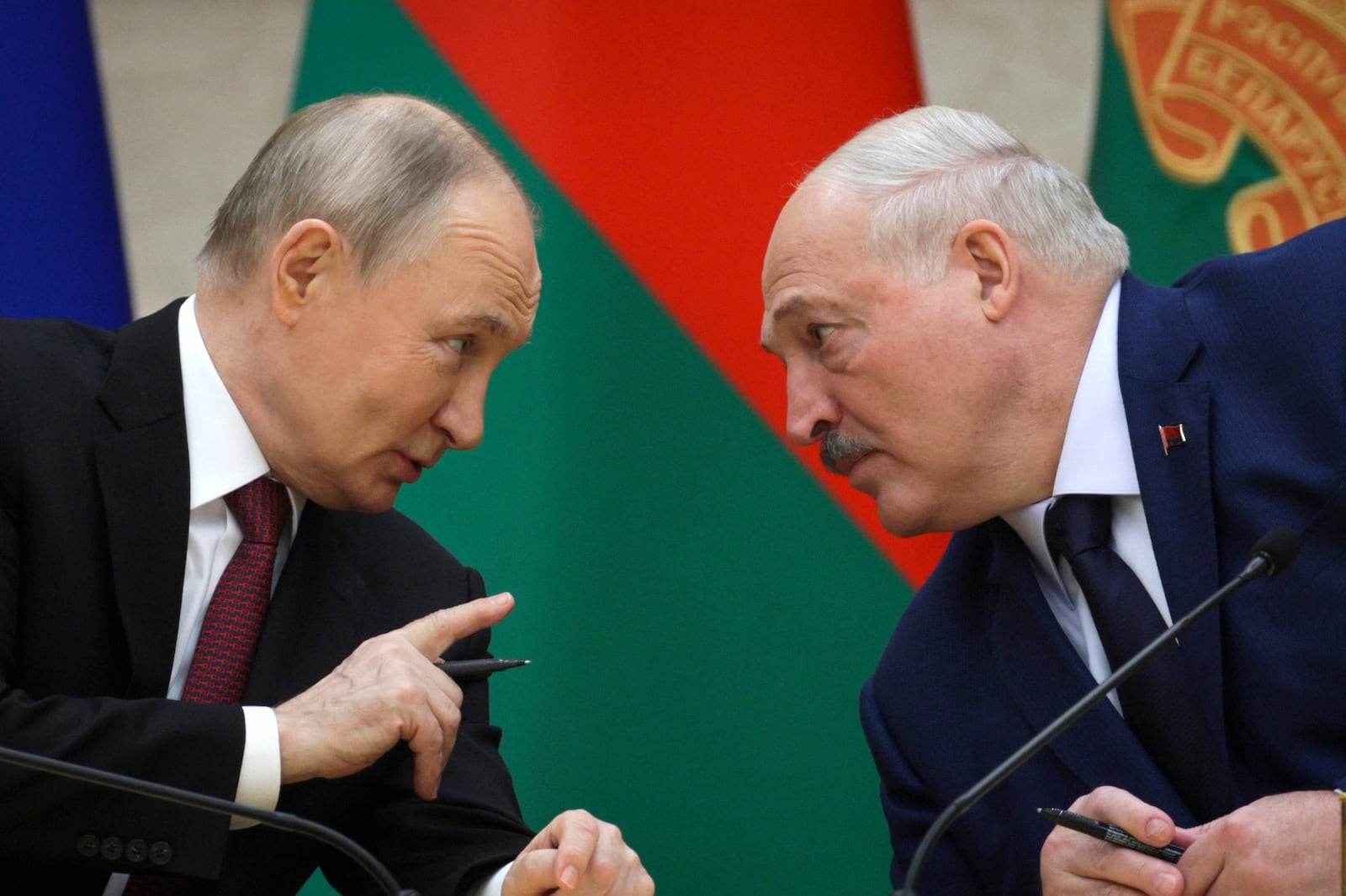 FILE - Russian President Vladimir Putin, left, and Belarusian President Alexander Lukashenko talk during a signing ceremony in Minsk, Belarus, Dec. 6, 2024. (Gavriil Grigorov, Sputnik, Kremlin Pool Photo via AP, File)