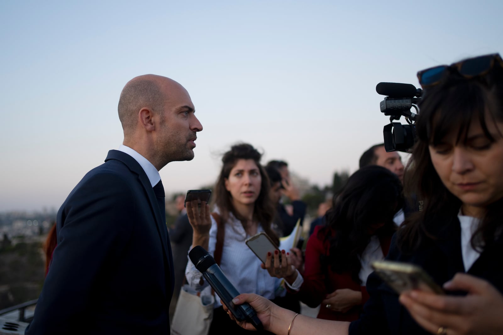 French Foreign Minister Jean-Noël Barrot, left, speaks to journalists from the Mount of Olives during his visit to Jerusalem, Thursday, Nov. 7, 2024. (AP Photo/Maya Alleruzzo)