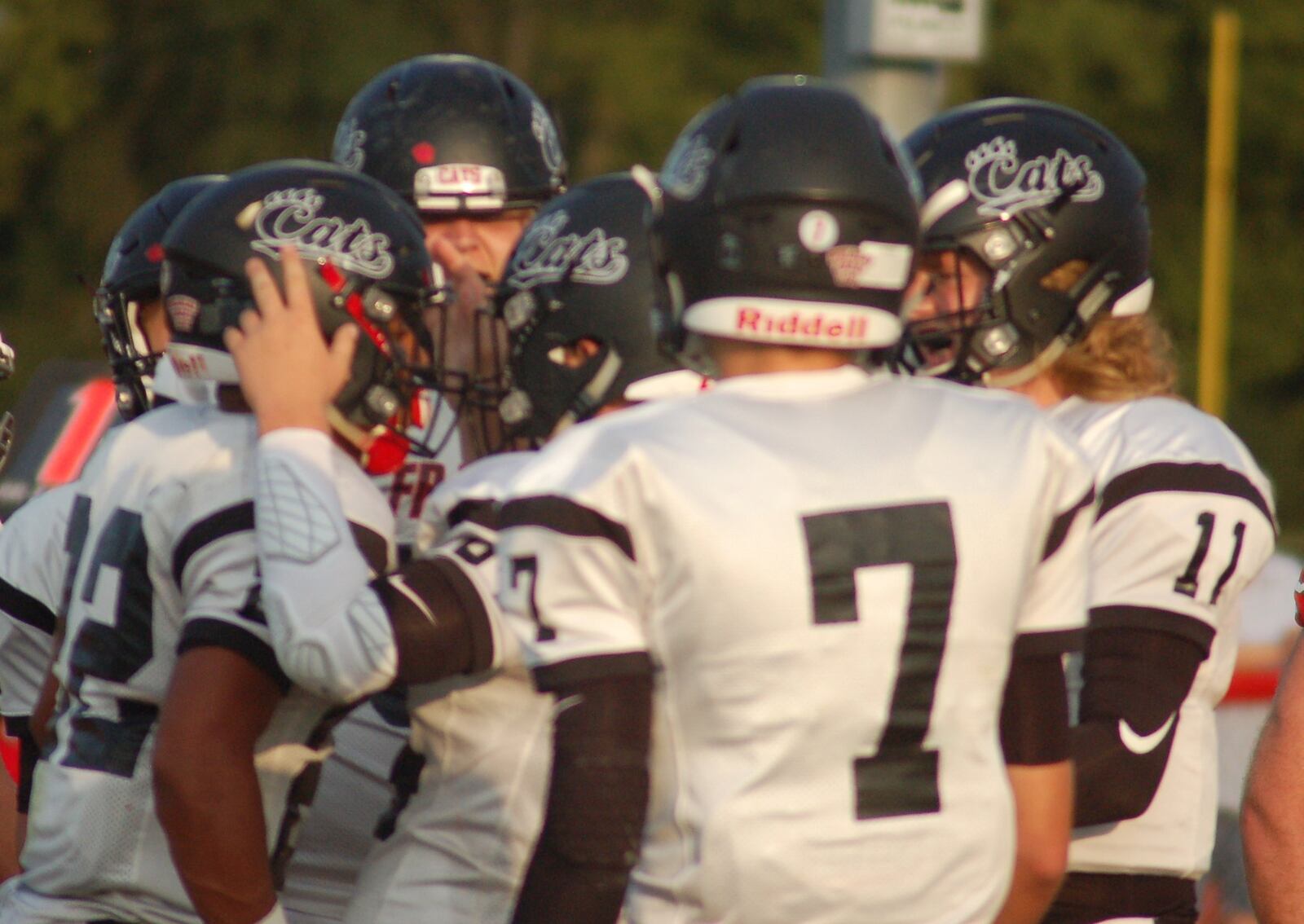 Franklin’s Ryan Montgomery (22) is greeted by his teammates after scoring one of his four touchdowns Friday night in a 47-14 victory over host Carlisle at Laughlin Field. CONTRIBUTED PHOTO BY JOHN CUMMINGS