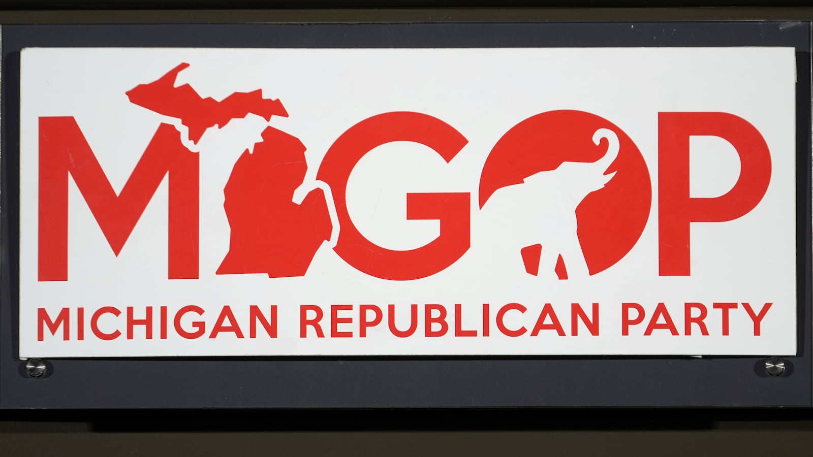 A sign is shown at the Michigan Republican Party Convention, Saturday, Feb. 22, 2025, in Detroit. (AP Photo/Paul Sancya)