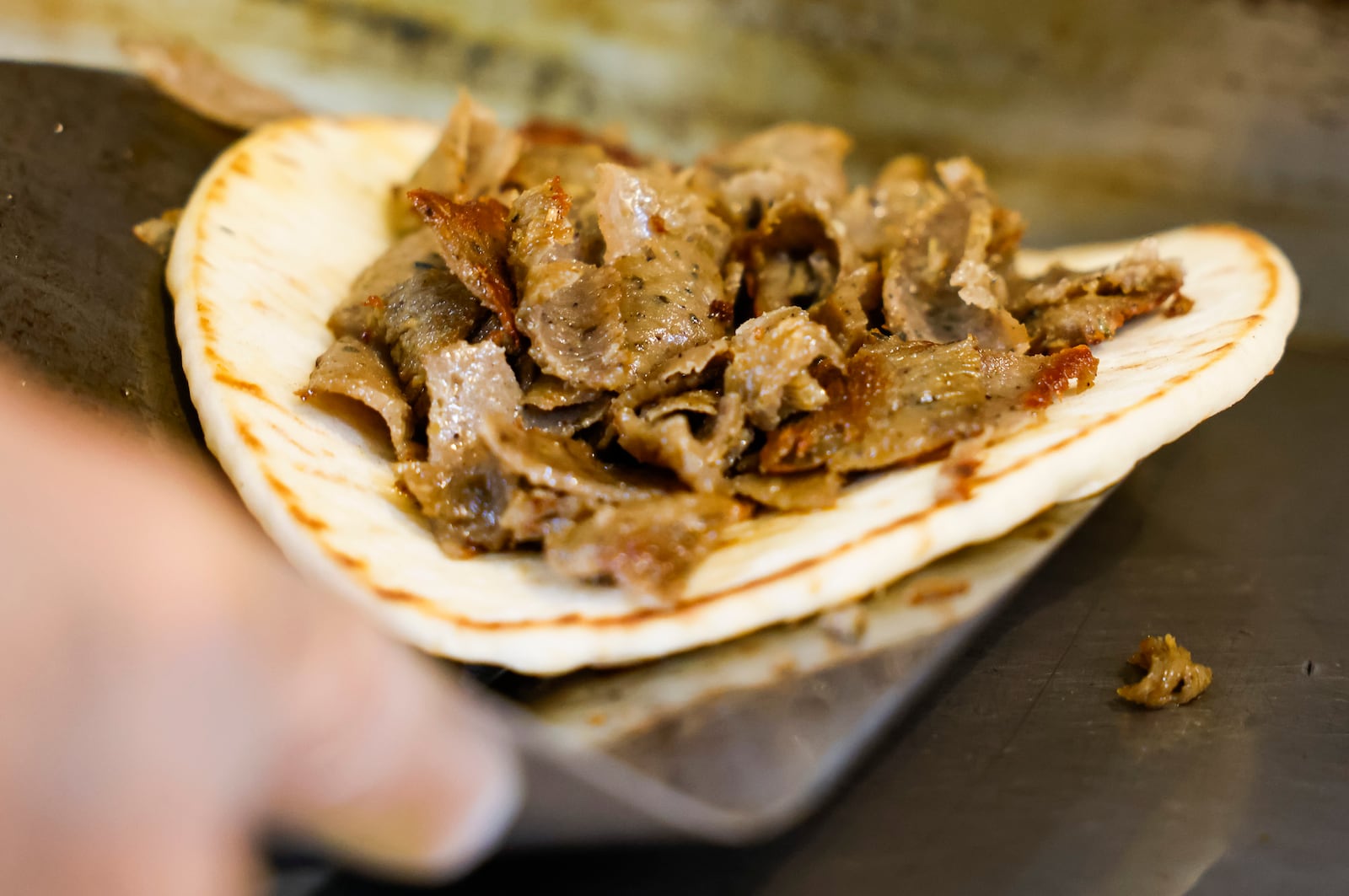 A gyro is on the on the grill at Tikka Grill in West Chester Township. Tikka Grill has locations on Cincinnati Dayton Road in West Chester Township and inside Jungle Jim's Eastgate. Tikka Grill serves a variety of food items including gyros, pita wraps, subs, Greek salads, shawarma, wings and more.