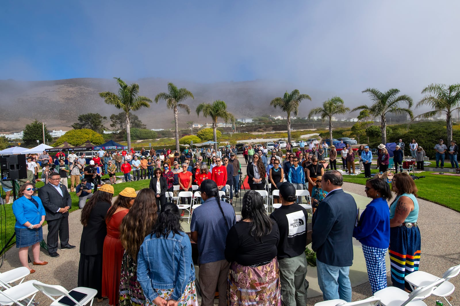 Public gather for the celebration and prayer ceremony of "Indigenous Peoples' Day Picinic In The Park 2024" and Chumash Heritage Natonal Marine Sanctuary at Dinosaur Caves Park, Pismo Beach. Calif. on Monday, October. 14, 2024. (Robert Schwemmer via AP)