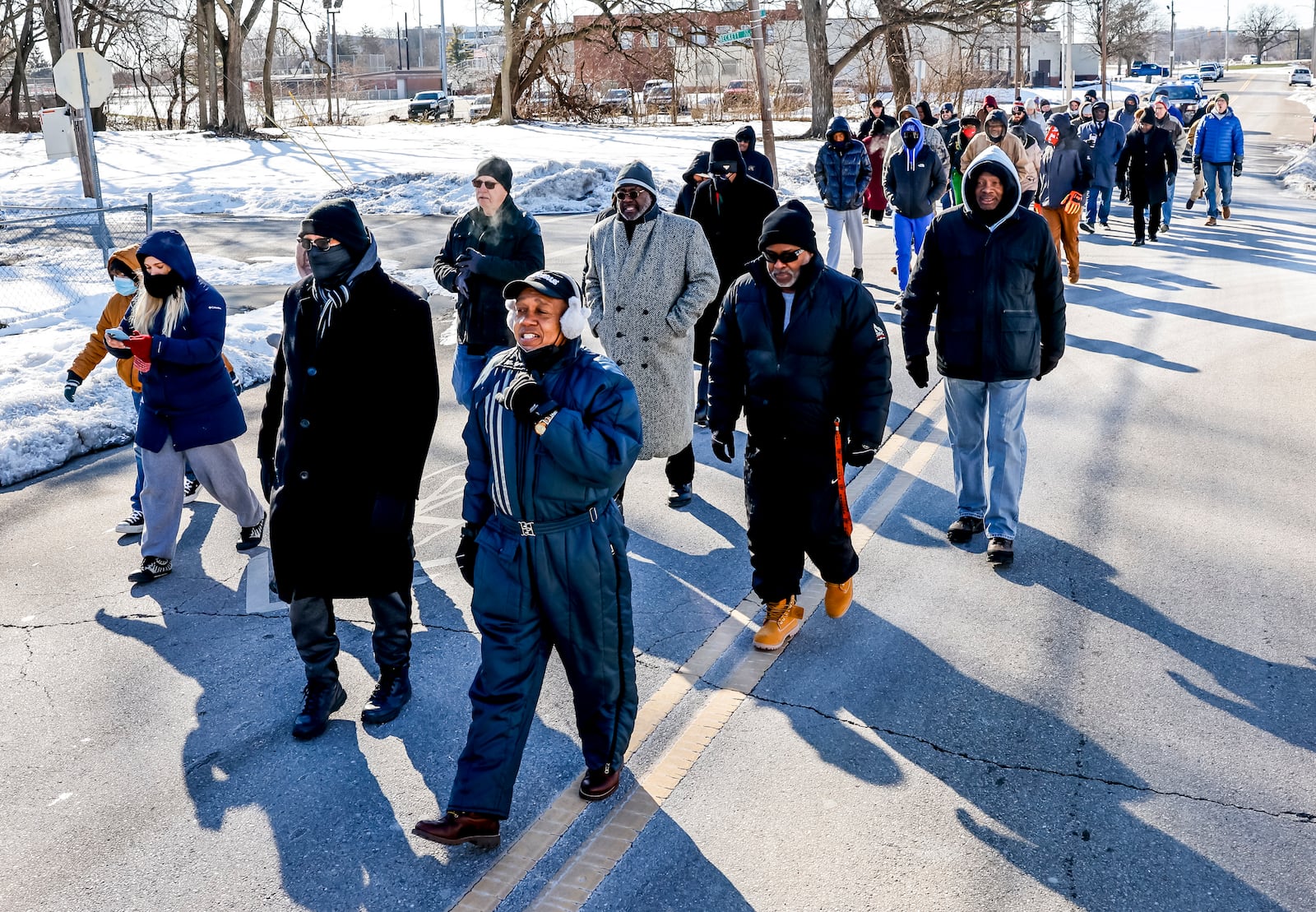 Rev. Victor Davis led a Martin Luther King Jr. Day march Monday, Jan. 20, 2025 in Hamilton. A large group marched from Booker T. Washington Community Center to High Street to Martin Luther King Jr. Blvd. and ended at St. Paul Miracle Center on S. Front Street for a service.  NICK GRAHAM / STAFF