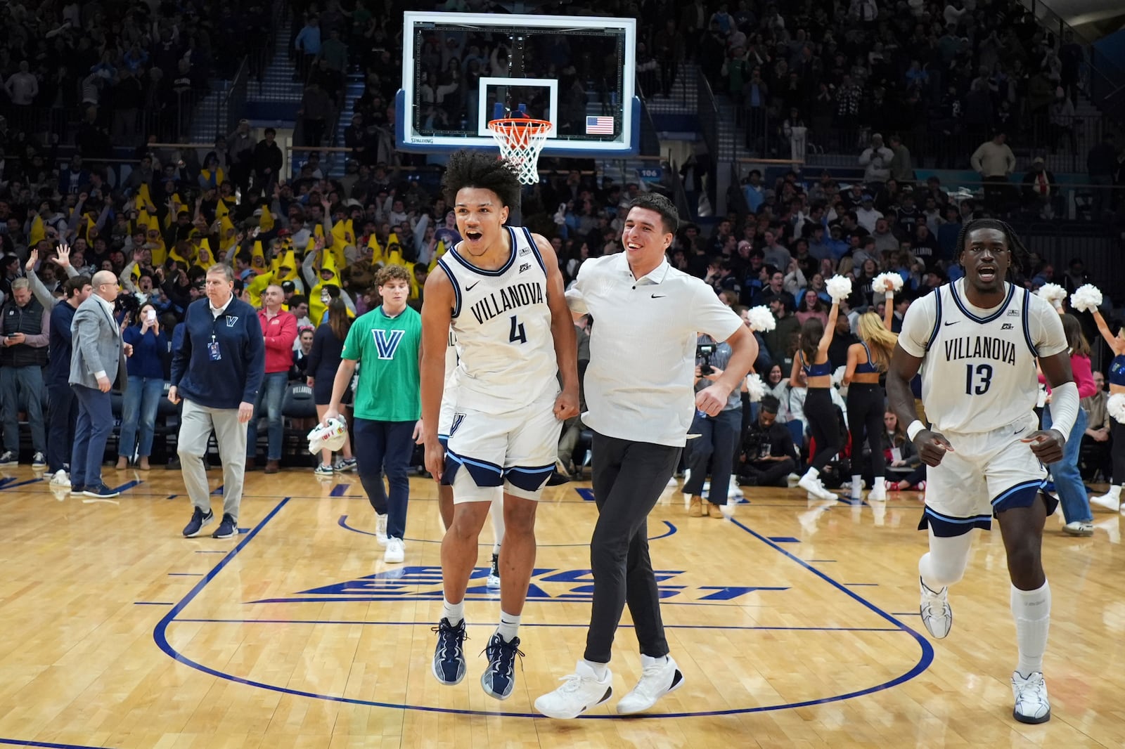 Villanova's Tyler Perkins (4) and Enoch Boakye (13) celebrate after Villanova won an NCAA college basketball game against St. John's, Wednesday, Feb. 12, 2025, in Villanova, Pa. (AP Photo/Matt Slocum)