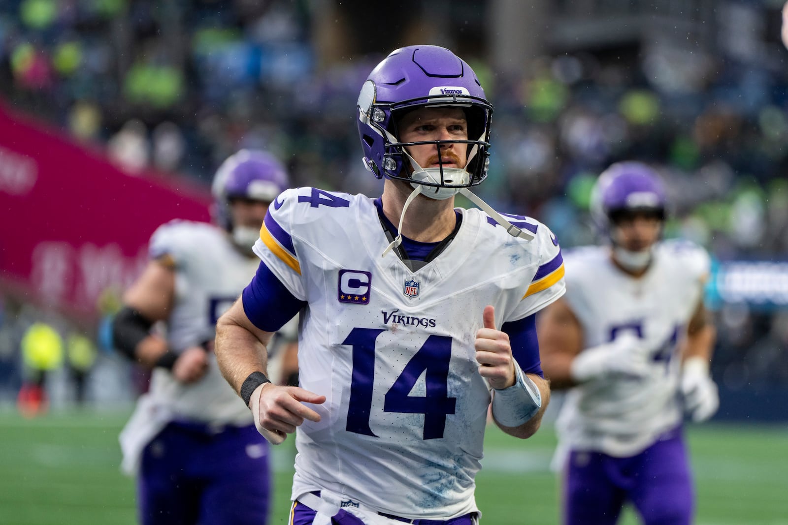 FILE - Minnesota Vikings quarterback Sam Darnold jogs off the field during an NFL football game against the Seattle Seahawks, Sunday, Dec. 22, 2024, in Seattle. (AP Photo/Stephen Brashear, File)