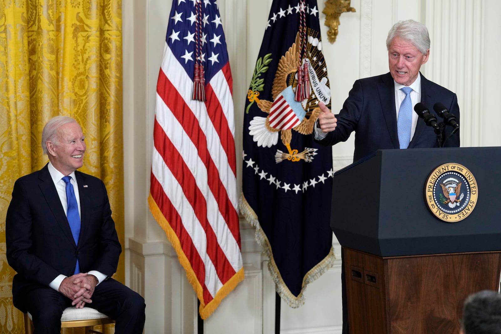 Former President Bill Clinton speaks as President Joe Biden listens during an event in the East Room of the White House in Washington, Thursday, Feb. 2, 2023, to mark the 30thAnniversary of the Family and Medical Leave Act. Clinton signed the FMLA into law 30 years ago. (AP Photo/Susan Walsh)