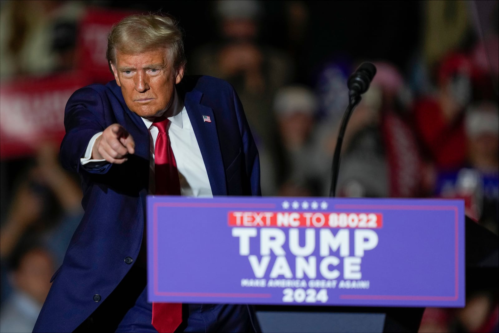 Republican presidential nominee former President Donald Trump gestures after speaking at a campaign rally at Williams Arena at Mignes Coliseum, Monday, Oct. 21, 2024, in Greenville, N.C. (AP Photo/Julia Demaree Nikhinson)