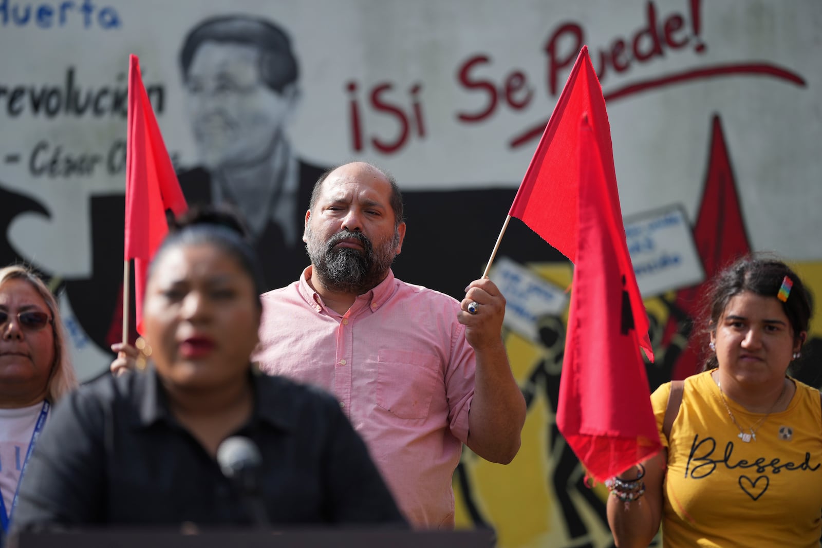 Members of La Unión del Pueblo Entero (LUPE), listen as Executive Director Tania Chavez makes statements about yesterday's election in San Juan, Texas, Wednesday, Nov. 6, 2024. (AP Photo/Eric Gay)