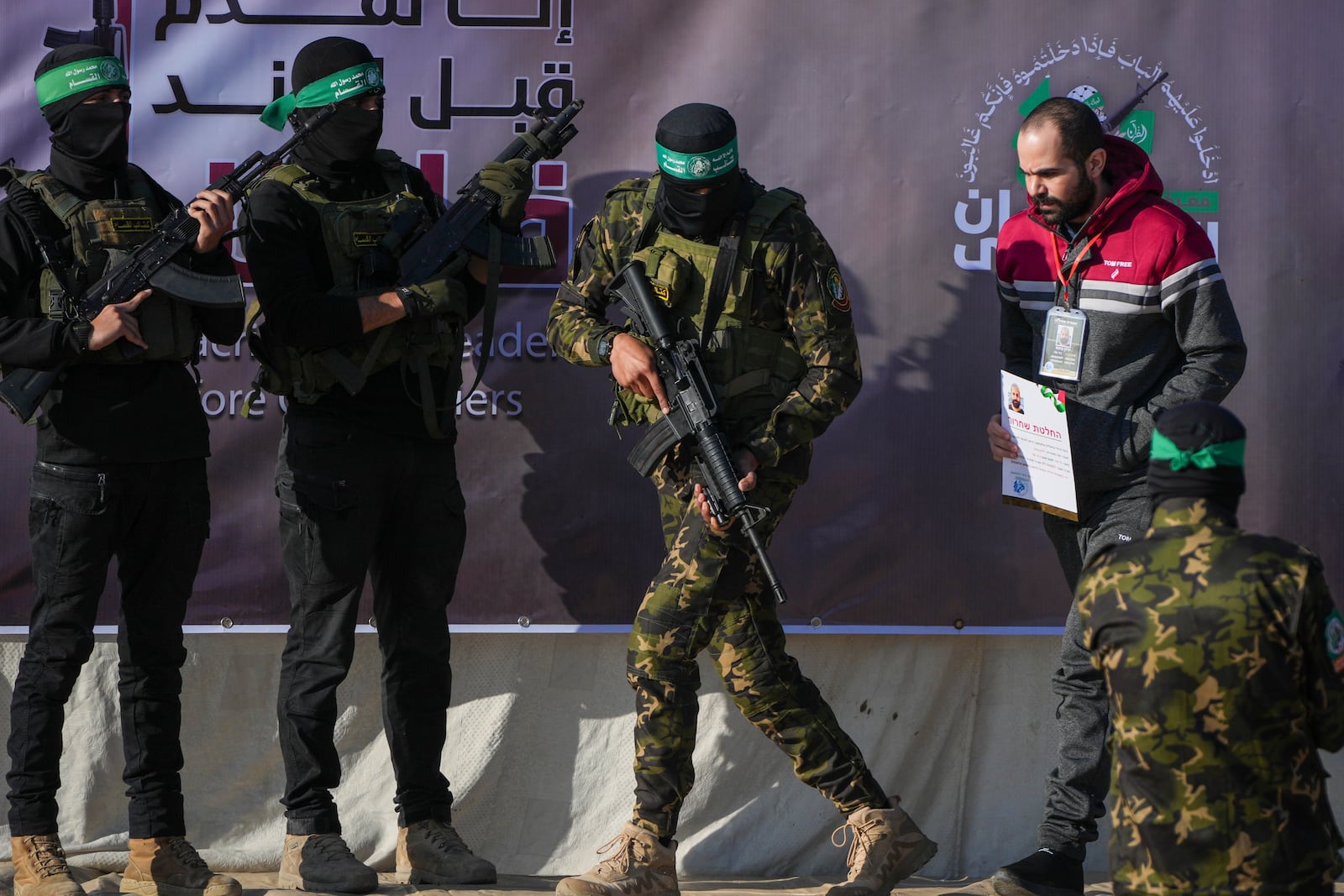 Israeli Yarden Bibas, 34, who has been held hostage by Hamas in Gaza since October 7, 2023, is escorted by Hamas fighters before being handed over to the Red Cross in Khan Younis, southern Gaza Strip, Saturday Feb. 1, 2025. Photo/Abdel Kareem)