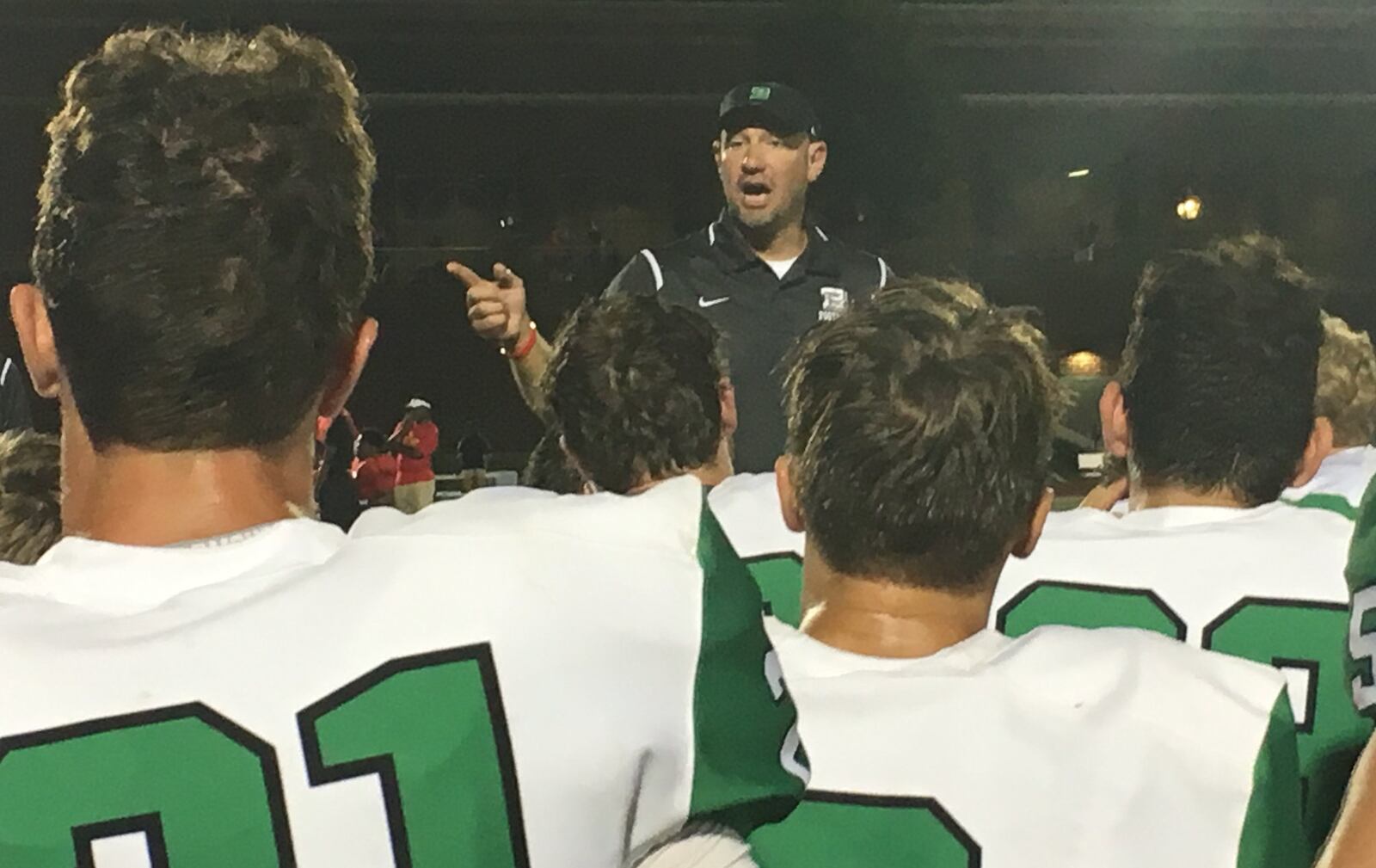 Badin coach Nick Yordy speaks to his team after a 42-12 triumph over Purcell Marian at Walnut Hills’ Marx Stadium on Sept. 16, 2017. RICK CASSANO/STAFF