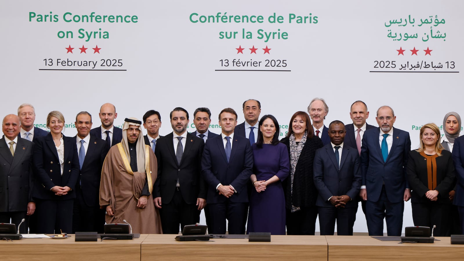 France's President Emmanuel Macron, center left, and on his side Syria's Interim Foreign Minister Asaad Al-Shibani pose for a photo with participants during the International Conference on Syria at the Ministerial Conference Center, in Paris, France, Thursday, Feb. 13, 2025. (Ludovic Marin, Pool Photo via AP)