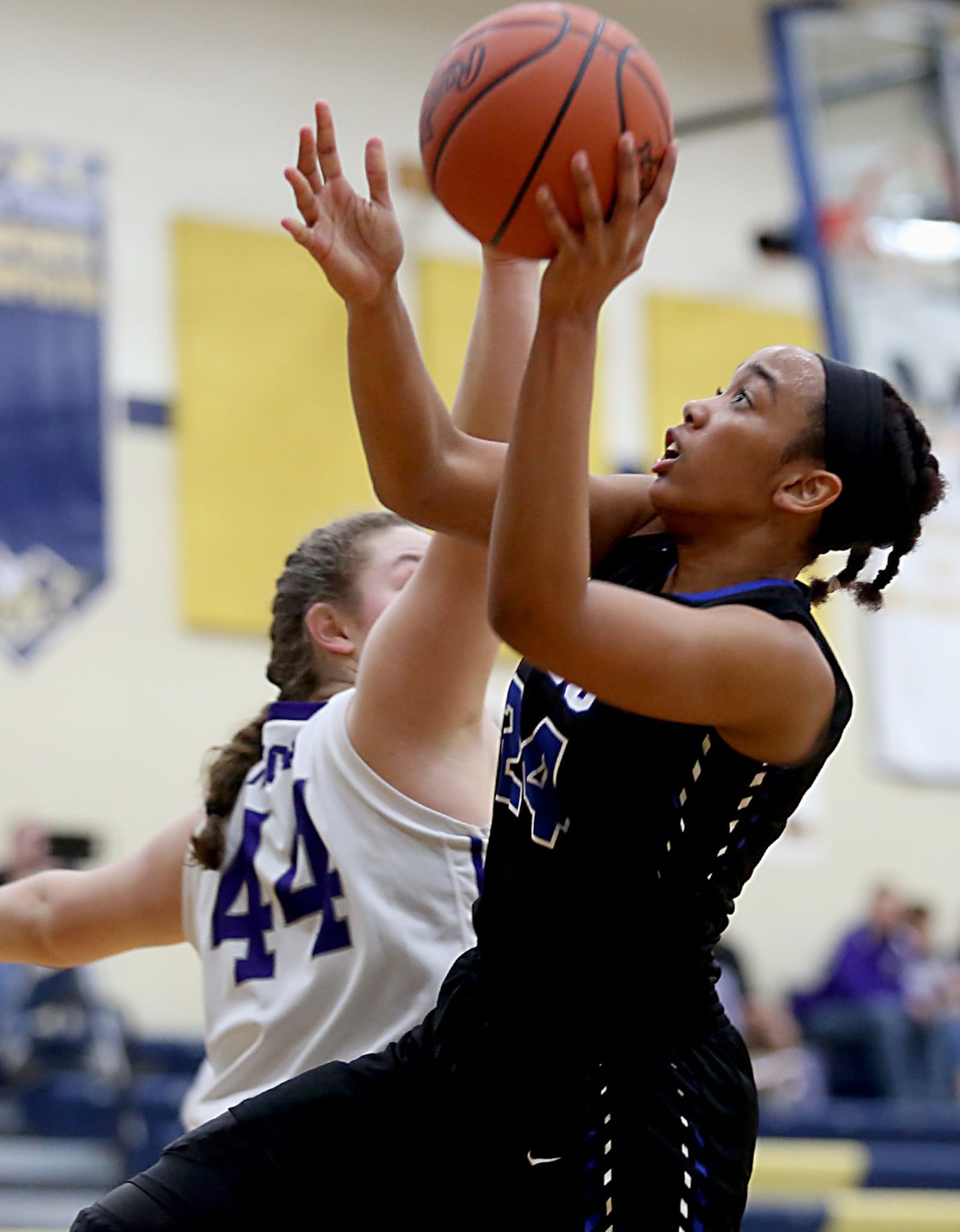 Cincinnati Christian guard Lyric Harris gets around Miami Valley Christian Academy center Dawsyn Vilardo for a shot Tuesday night during their Division IV sectional game at Monroe. CONTRIBUTED PHOTO BY E.L. HUBBARD