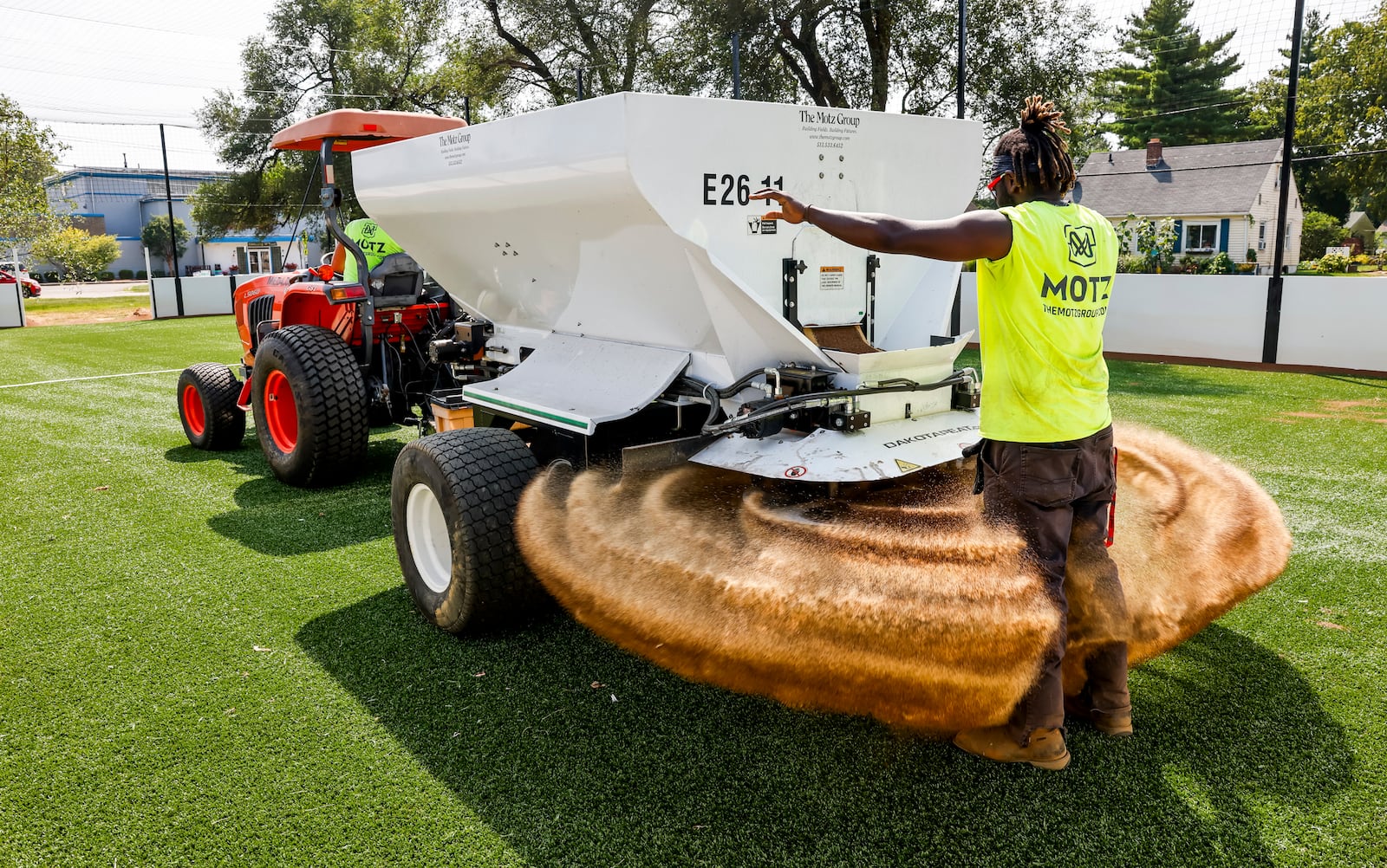 Robert Scott with Motz Group works on a installing a miniature turf soccer field at Douglass Park Wednesday, Aug. 23, 2023 in Middletown. NICK GRAHAM/STAFF