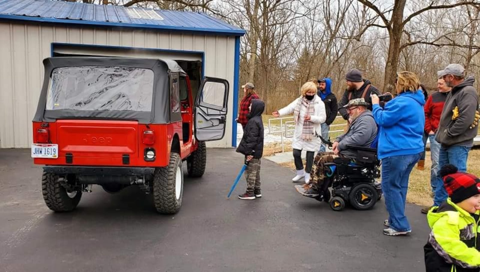 Bill Hammock, an Air Force veteran diagnosed with Lou Gehrig's disease, was surprised Saturday when his rebuilt 1979 Jeep was delivered. Numerous volunteers spent the last five months doing about $25,000 worth of repairs to the Jeep. SUBMITTED PHOTO