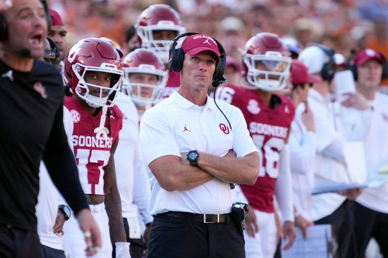 Oklahoma head football coach Brent Venables, center, watches play against Texas late in the second half of an NCAA college football game in Dallas, Saturday, Oct. 12, 2024. (AP Photo/Jeffrey McWhorter)