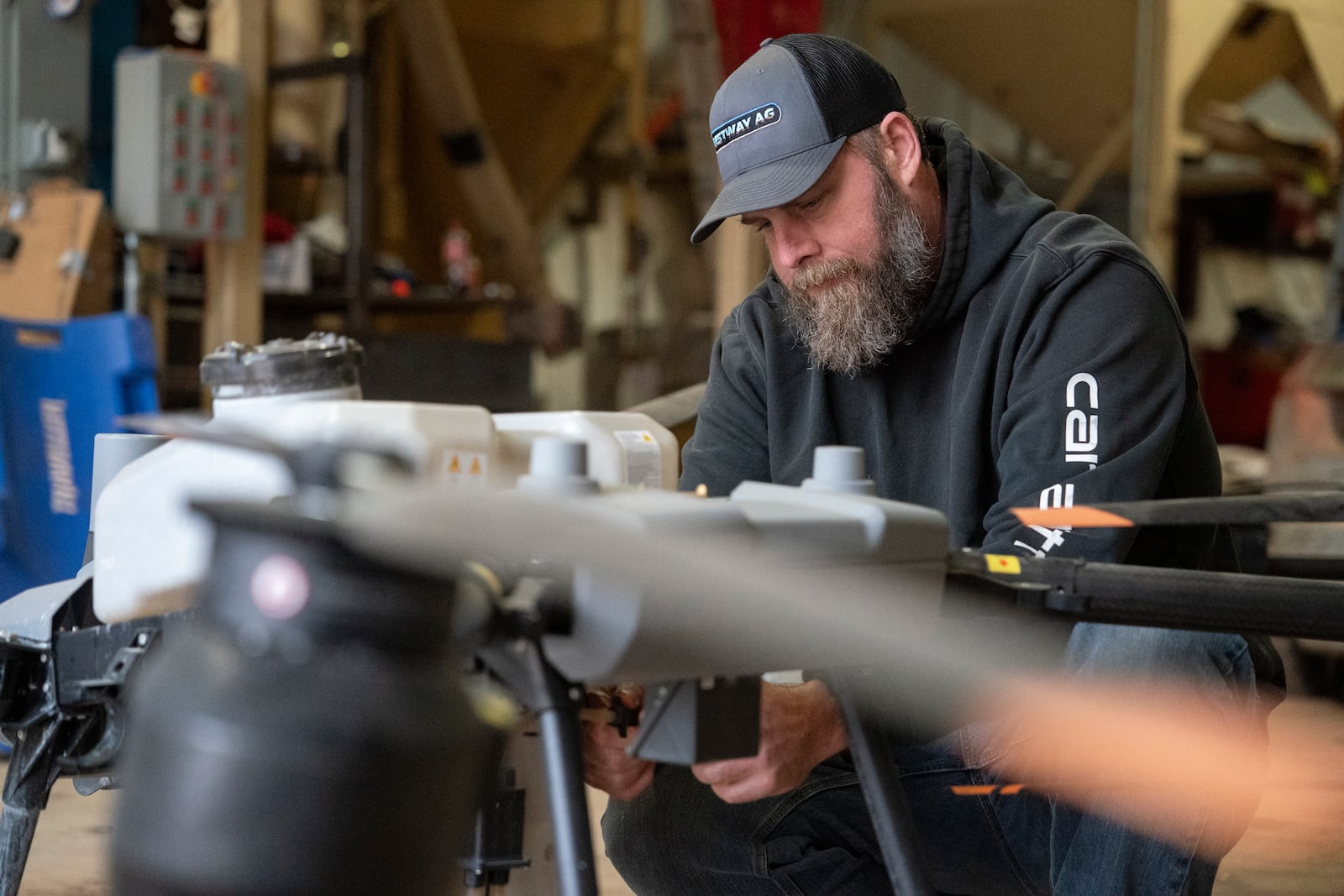 Russell Hedrick prepares a DJI drone to put crop cover on his farm, Tuesday, Dec. 17, 2024, in Hickory, N.C. (AP Photo/Allison Joyce)