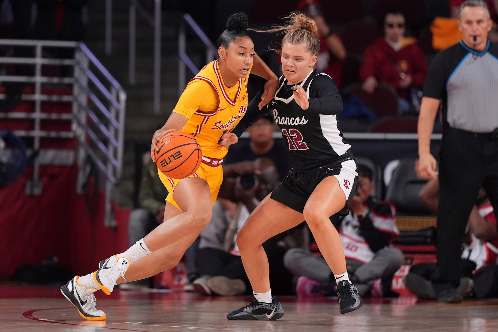 Southern California guard JuJu Watkins, left, drives against Santa Clara guard Maddie Naro during the first half of an NCAA college basketball game, Friday, Nov. 15, 2024, in Los Angeles. (AP Photo/Mark J. Terrill)