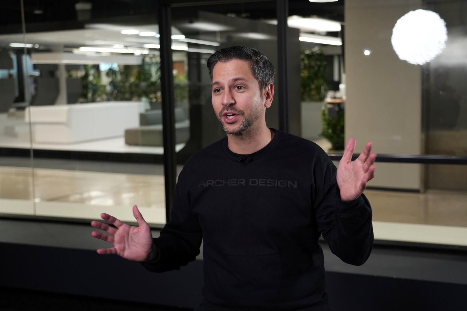 Archer Aviation CEO Adam Goldstein speaks at the company's headquarters in San Jose, Calif. on Friday, Dec. 13, 2024. (AP Photo/Terry Chea)