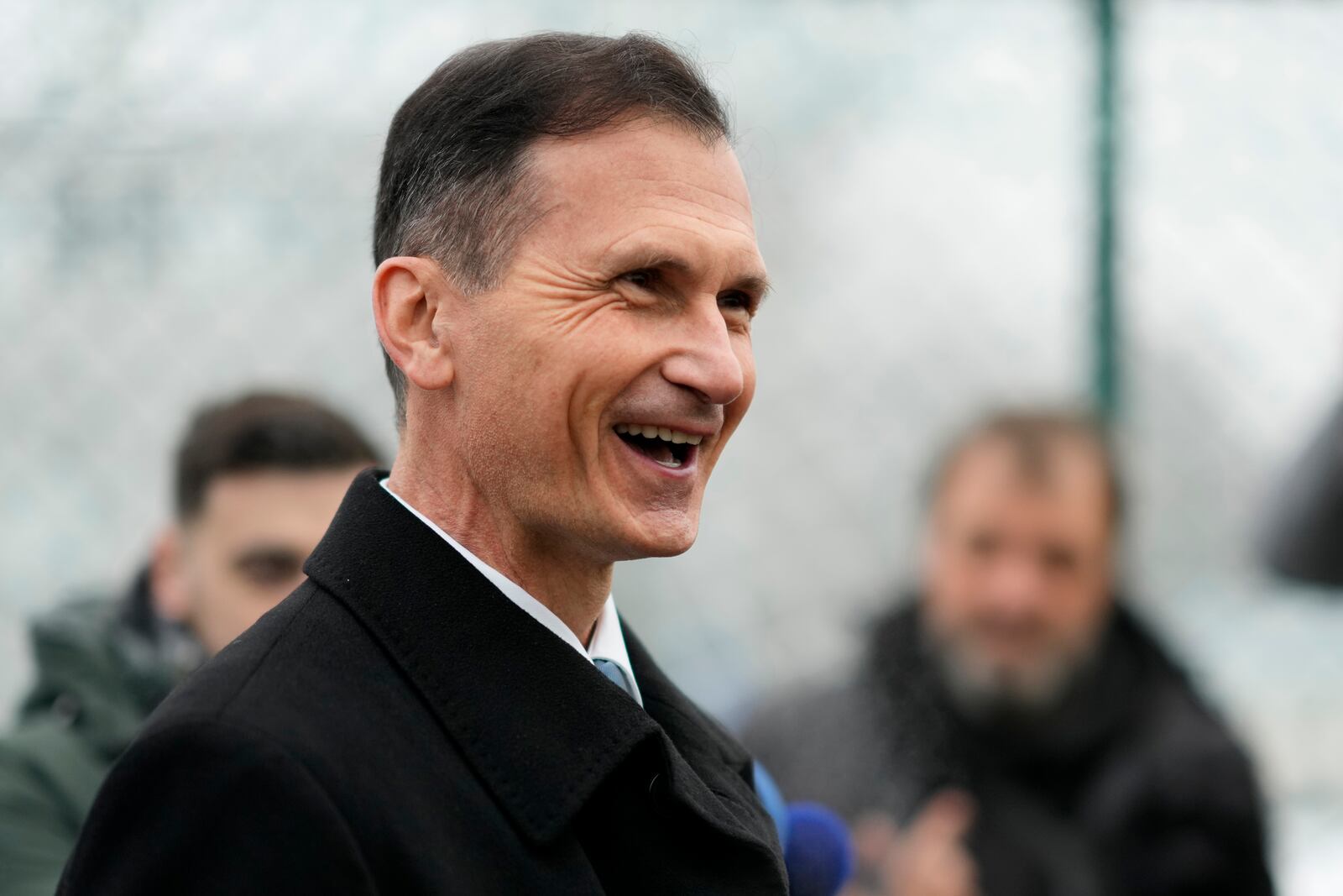 Presidential candidate Dragan Primorac talks to media during a runoff vote for the Croatian presidential election at a polling station in Zagreb, Croatia, Sunday, Jan. 12, 2025. (AP Photo/Darko Bandic)