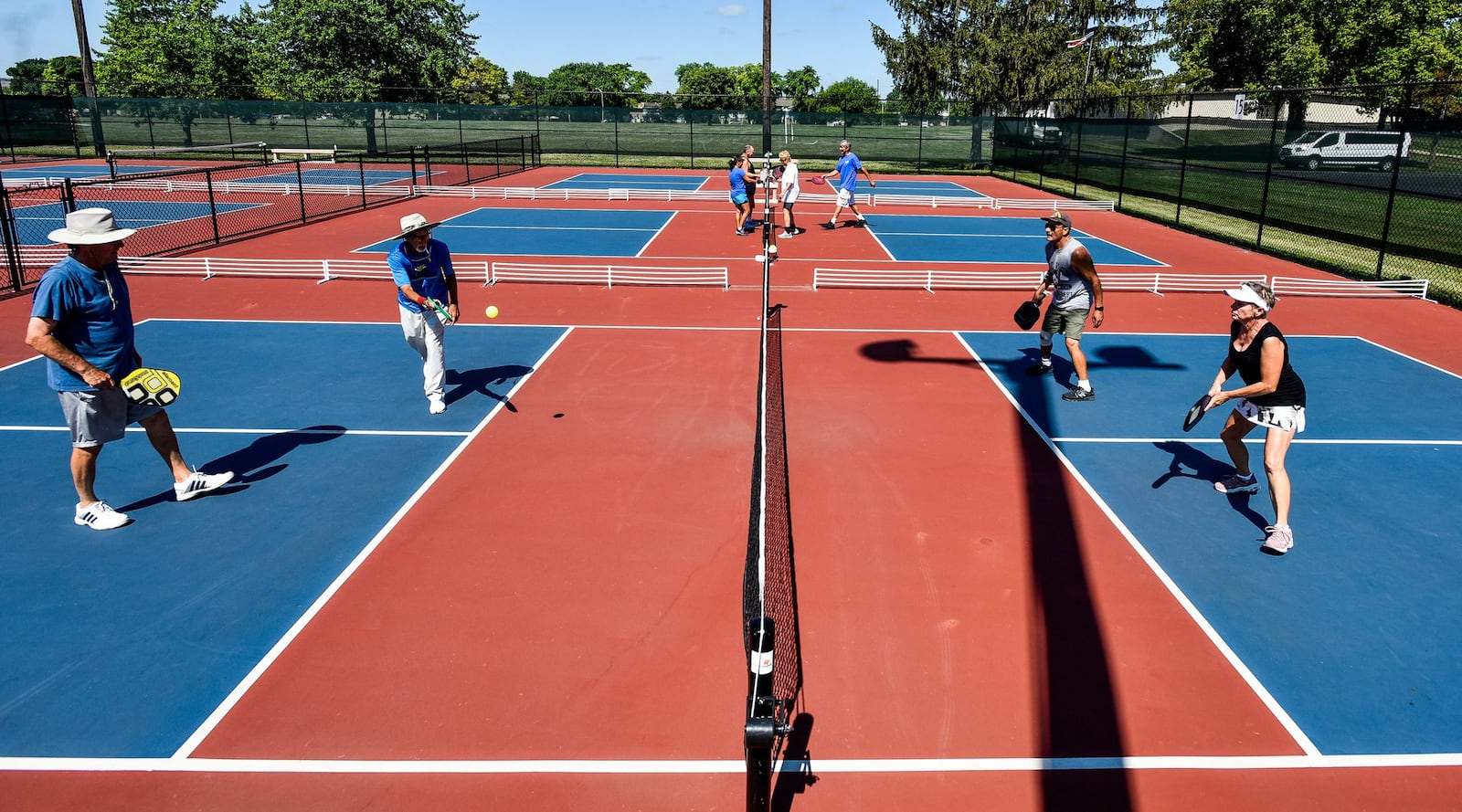 A group plays pickleball Friday, July 12 at the Middletown Pickleball Association courts at Lefferson Park in Middletown. The 12th Annual Middletown Senior Pickleball Tournament is August 1-3 and over 270 players from 8 states are registered to play. Free lessons are offered every Wednesday at 6:00 pm for those interested in playing but new to the sport. Paddles and balls are available to use for those that do not have their own. NICK GRAHAM/STAFF