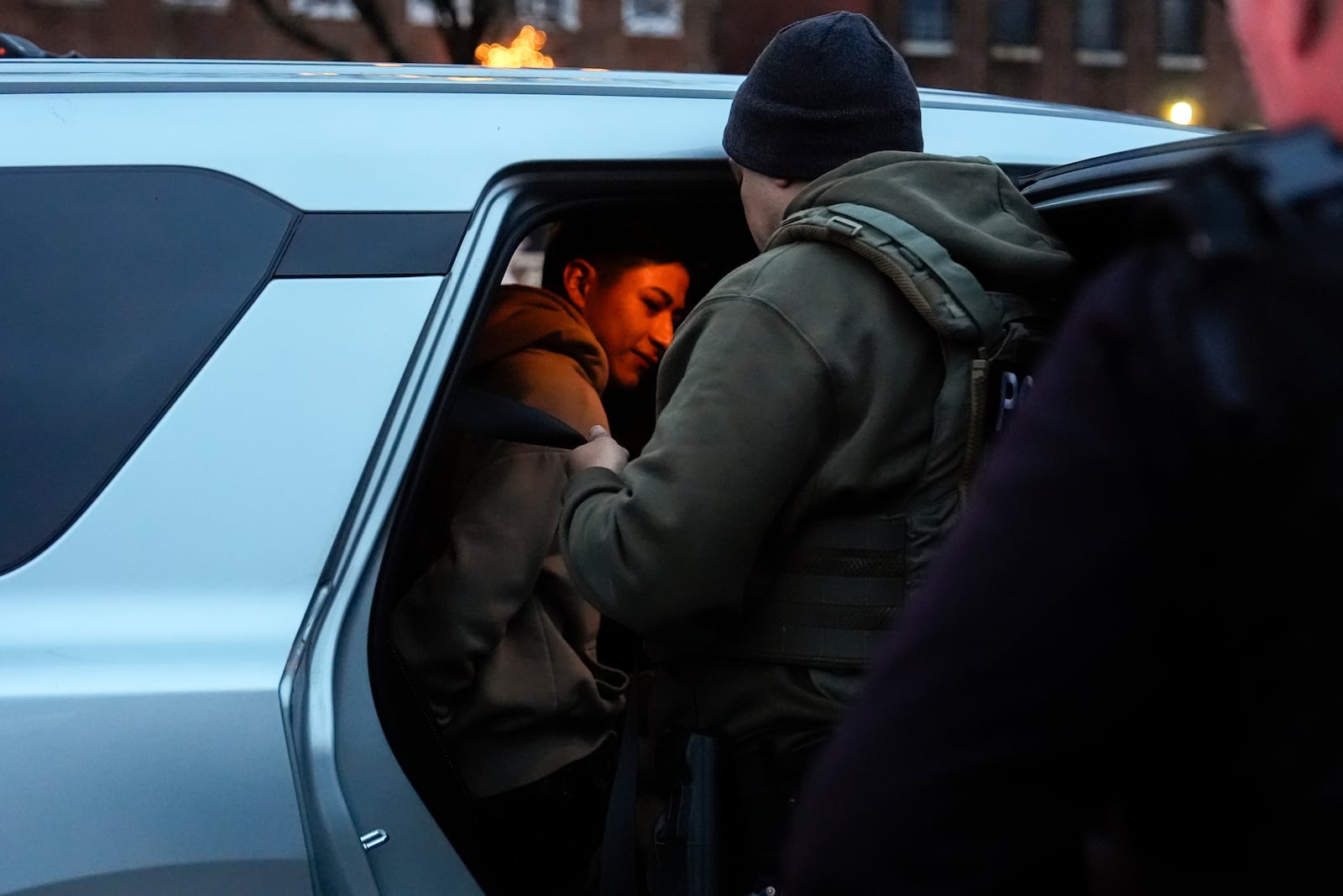 Deportation officers with Enforcement and Removal Operations in U.S. Immigration and Customs Enforcement's New York City field office arrest Wilmer Patricio Medina-Medina during an early morning operation, Tuesday, Dec. 17, 2024, in the Bronx borough of New York. (AP Photo/Julia Demaree Nikhinson)