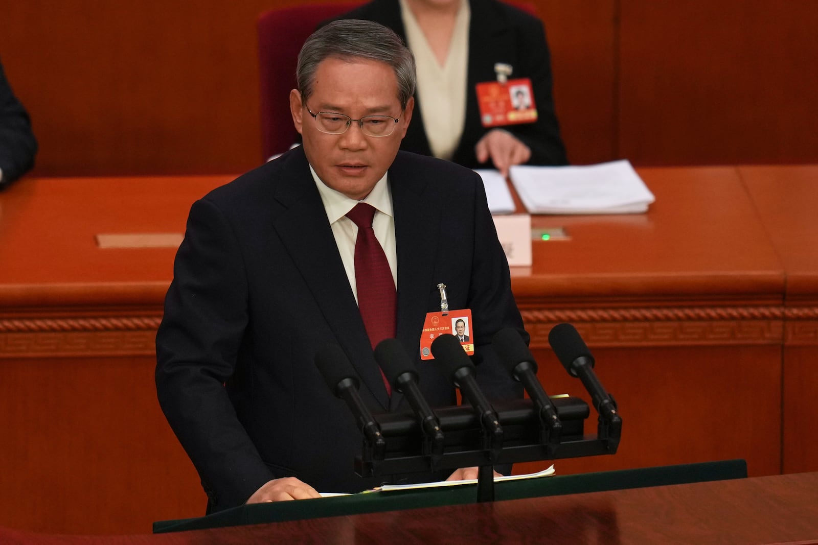 Chinese Premier Li Qiang speaks during the opening session of the National People's Congress (NPC) at the Great Hall of the People in Beijing, China, Wednesday, March 5, 2025. (AP Photo/Ng Han Guan)