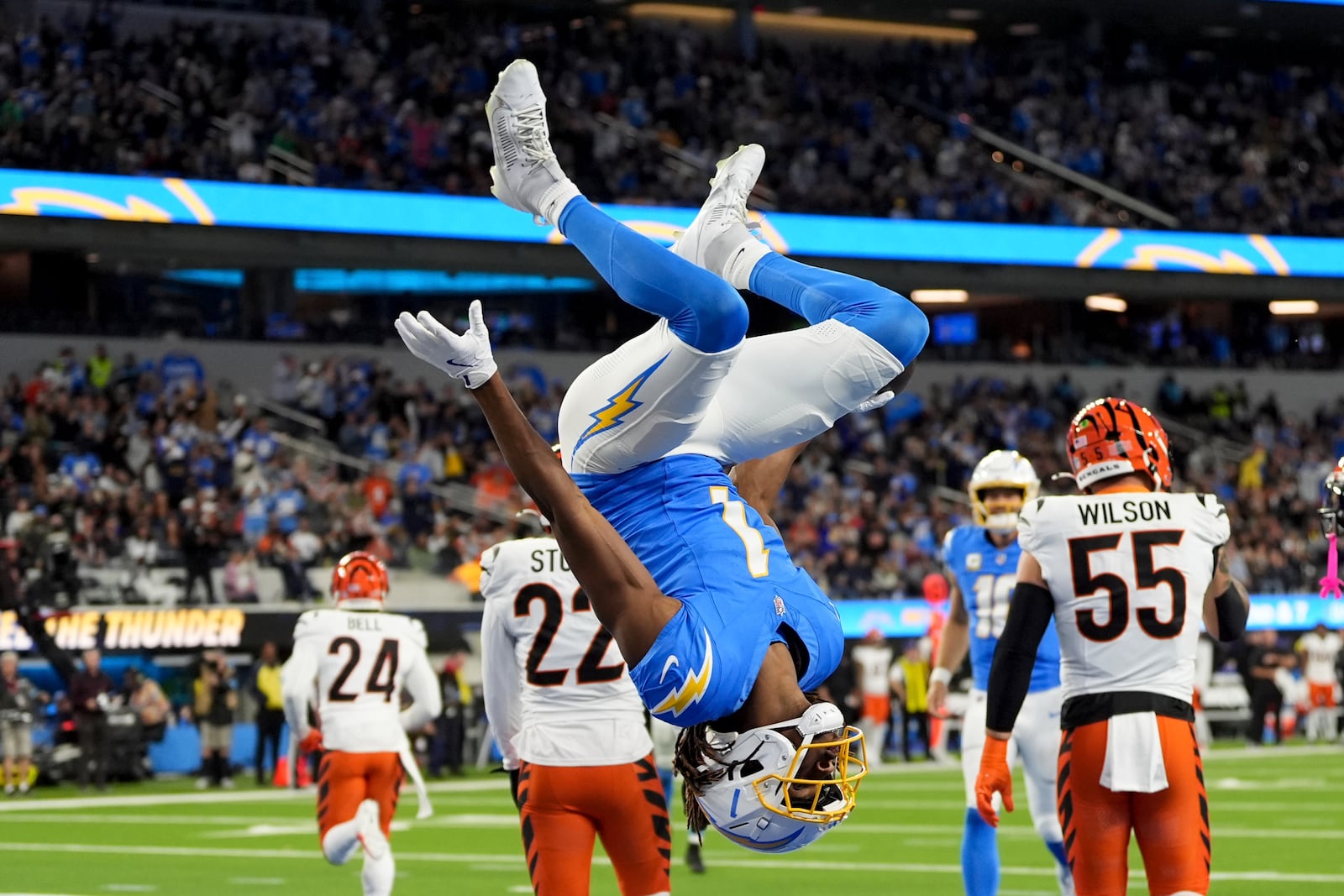 Los Angeles Chargers wide receiver Quentin Johnston (1) does a back flip in the end zone after his touchdown catch during the first half of an NFL football game against the Cincinnati Bengals, Sunday, Nov. 17, 2024, in Inglewood, Calif. (AP Photo/Gregory Bull)