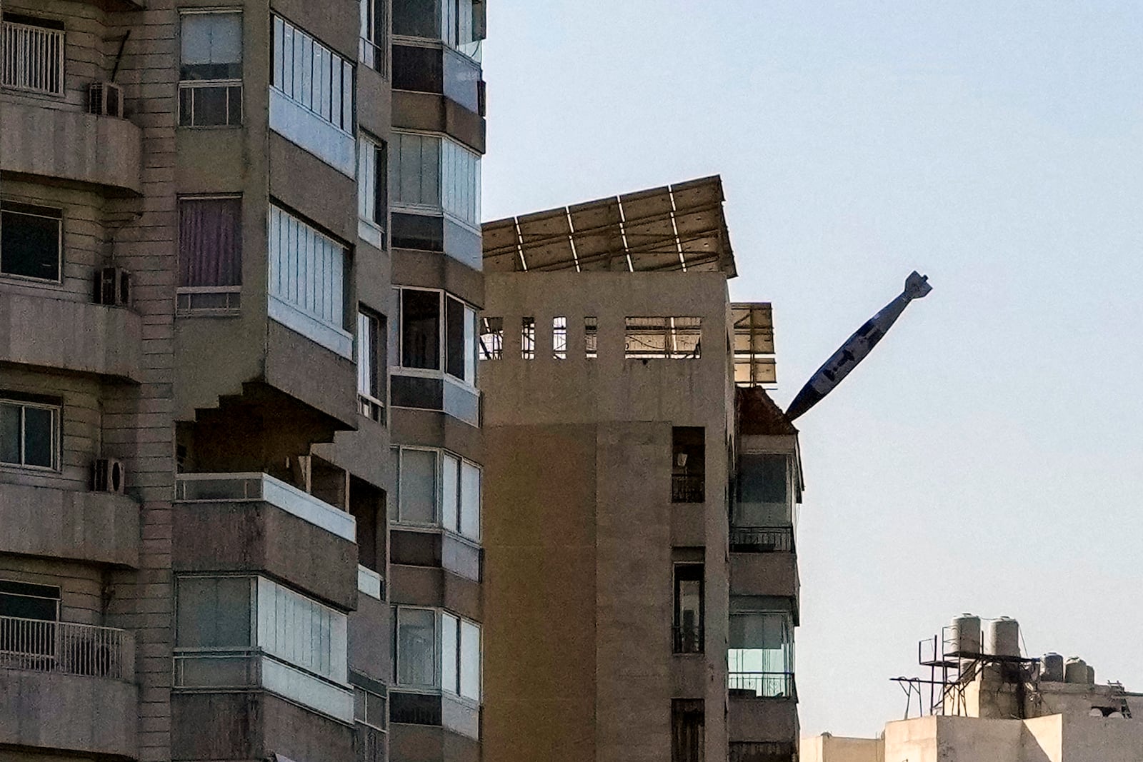 FILE - A bomb dropped from an Israeli jet is seen just before it hits a building in Tayouneh, Beirut, Lebanon, on Nov. 15, 2024. (AP Photo/Hassan Ammar, File)