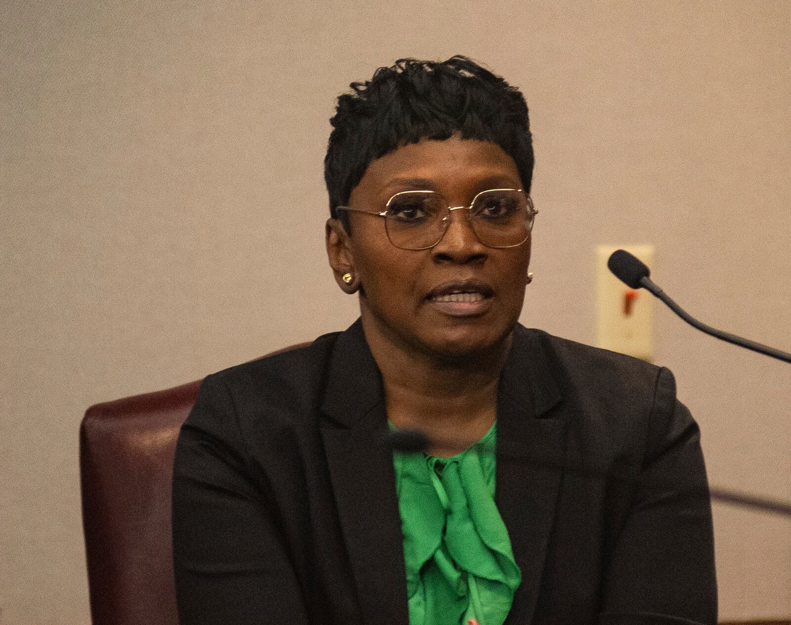 Wanda Cooper-Jones pauses to compose herself as she testifies about a police officer calling her to tell her son Ahmaud Arbery had been shot dead while committing a burglary. His killers were later convicted of murder. (Michael Hall/The Brunswick News via AP, Pool)