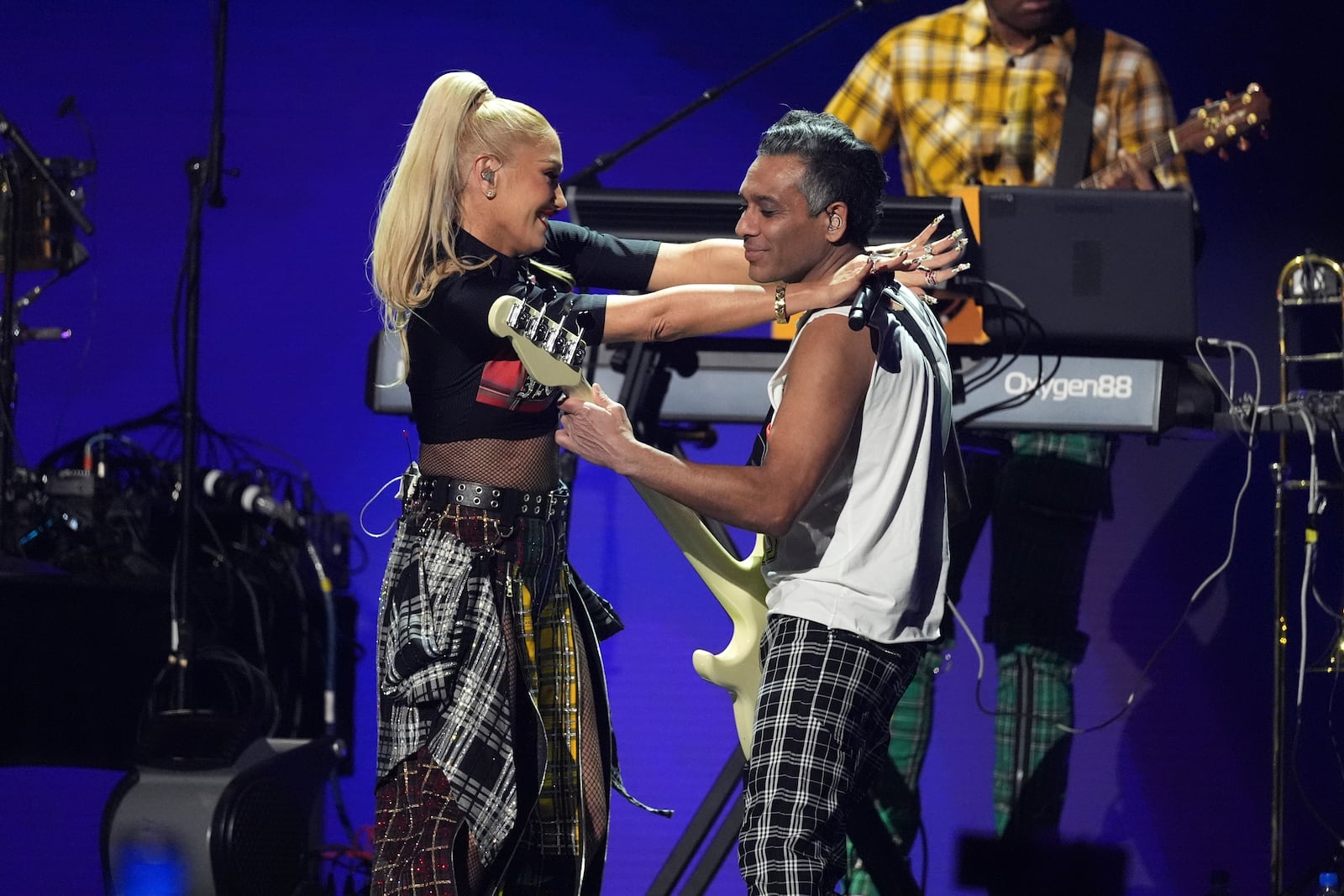 Gwen Stefani, left, and Tony Kanal of No Doubt perform during the FireAid benefit concert on Thursday, Jan. 30, 2025, at The Forum in Inglewood, Calif. (AP Photo/Chris Pizzello)