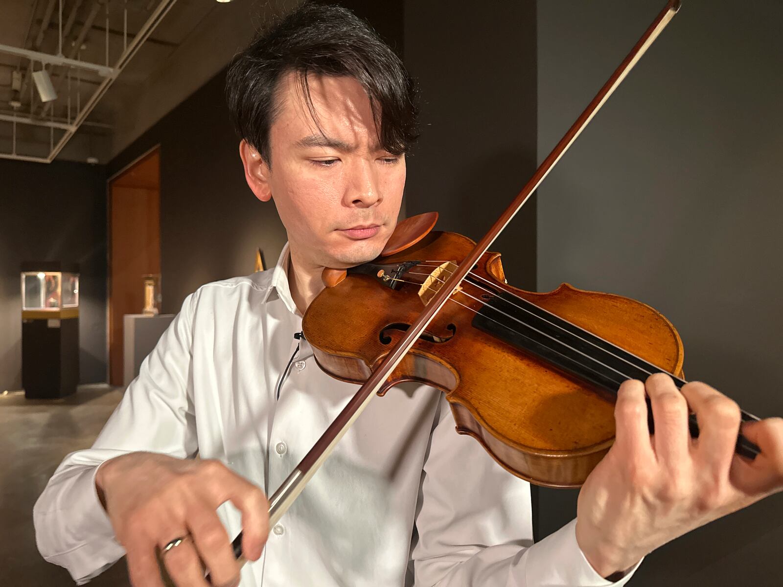 Violinist Stefan Jackiw plays the 1714 Joachim-Ma Stradivarius at Sotheby's auction house in New York on Monday, Feb. 3, 2025. (AP Photo/Ted Shaffrey)