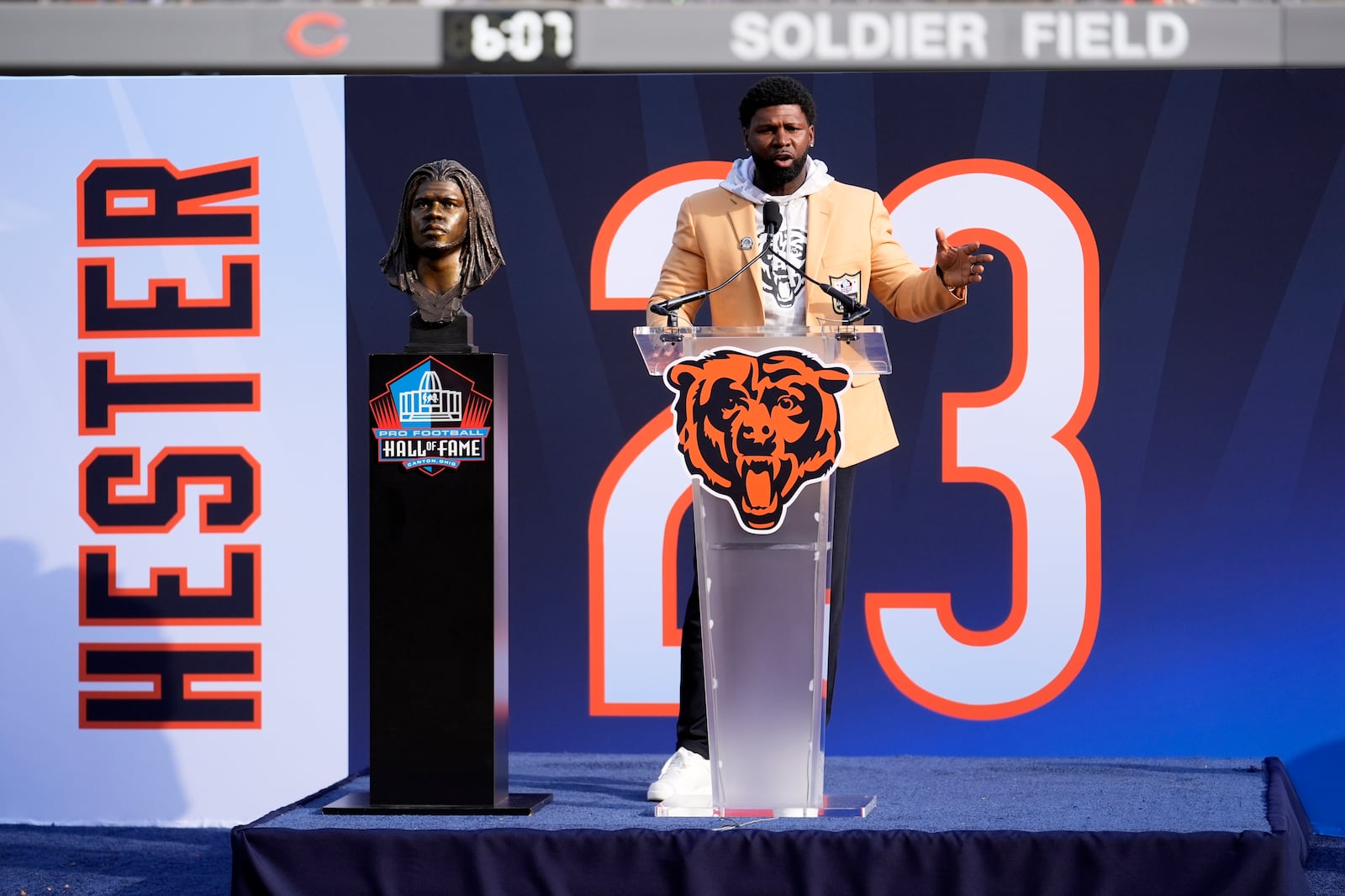 Former Chicago Bears Devin Hester speaks during a halftime ceremony of an NFL football game between the Chiicago Bears and Green Bay Packers Sunday, Nov. 17, 2024, in Chicago. (AP Photo/Charles Rex Arbogast)