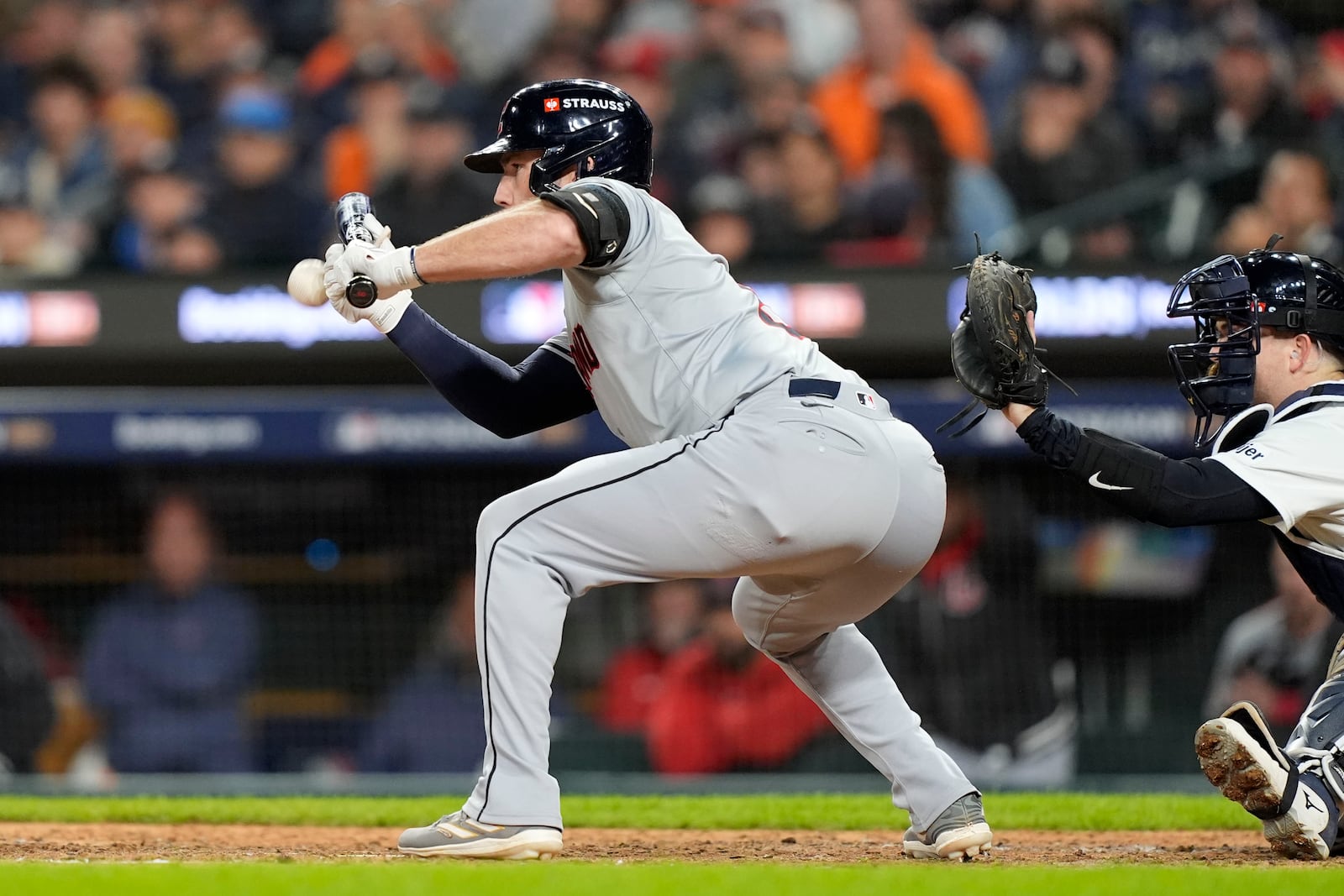 Cleveland Guardians' David Fry bunts in the ninth inning during Game 4 of a baseball American League Division Series against the Detroit Tigers, Thursday, Oct. 10, 2024, in Detroit. (AP Photo/Carlos Osorio)