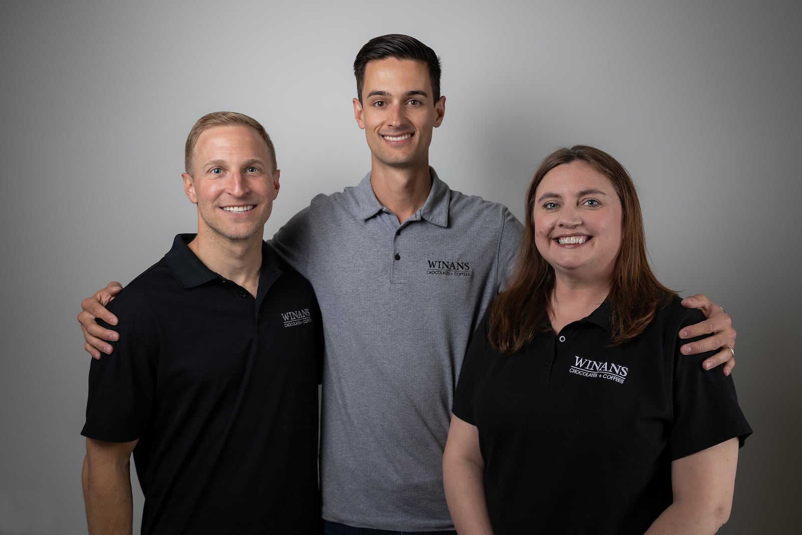 Amy Snyder served as COO of Winans Chocolates + Coffees. The executive team includes Dusty Blythe (left, financial controller and director of marketing) and Wilson Reiser (center, CEO). CONTRIBUTED