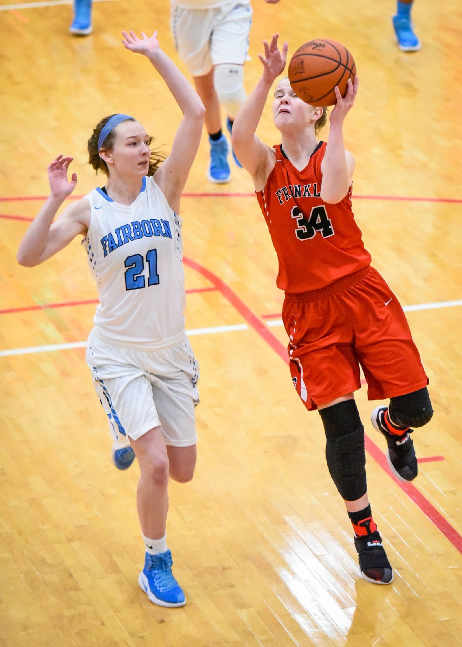 Franklin’s Brooke Stover has her shot defended by Fairborn’s Ashley Dagnan during their Division I sectional game Monday night at Troy. NICK GRAHAM/STAFF