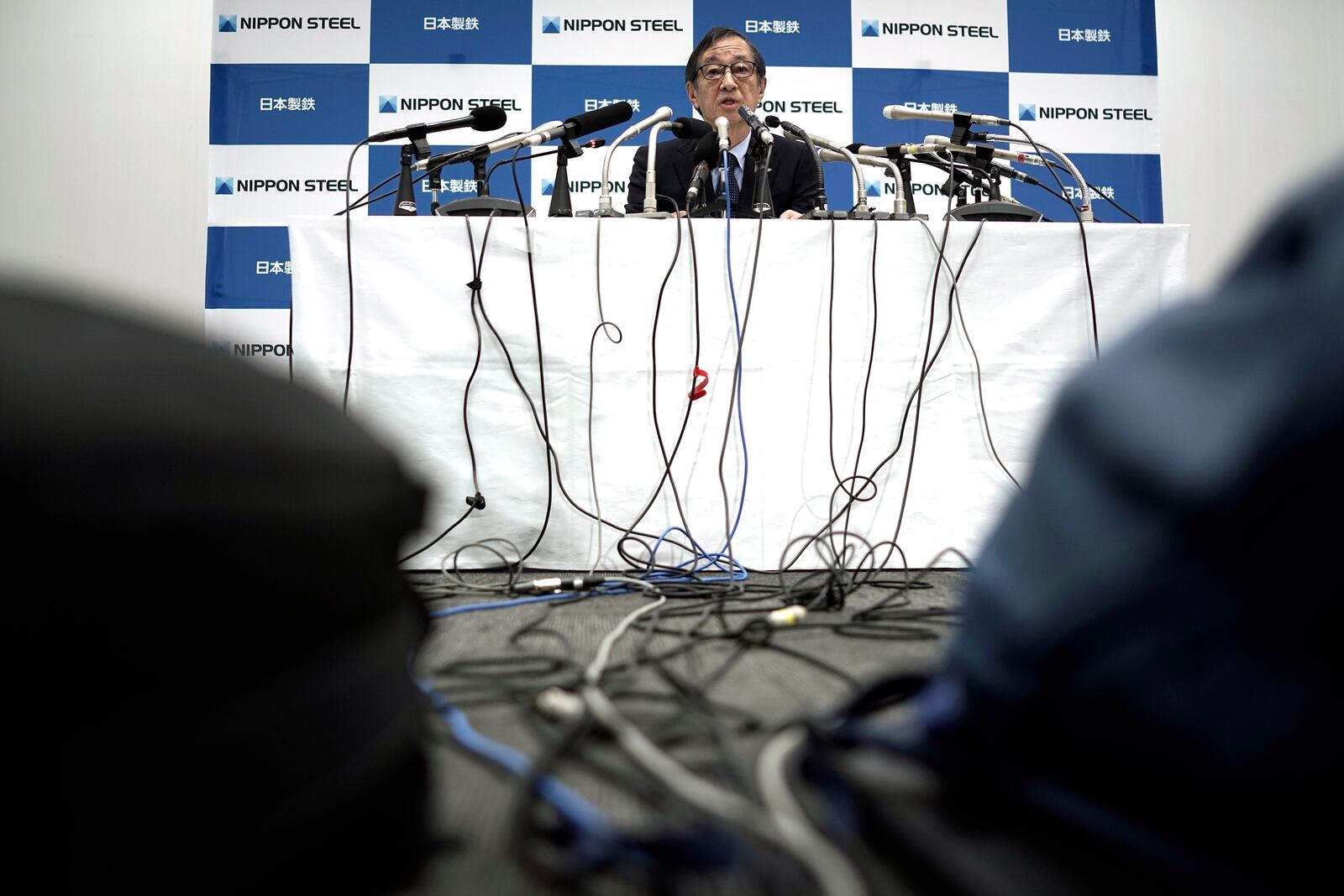 Eiji Hashimoto, chairman and CEO of Nippon Steel Corporation, answers a question during a press conference at their company headquarters Tuesday, Jan. 7, 2025, in Tokyo. (AP Photo/Eugene Hoshiko)