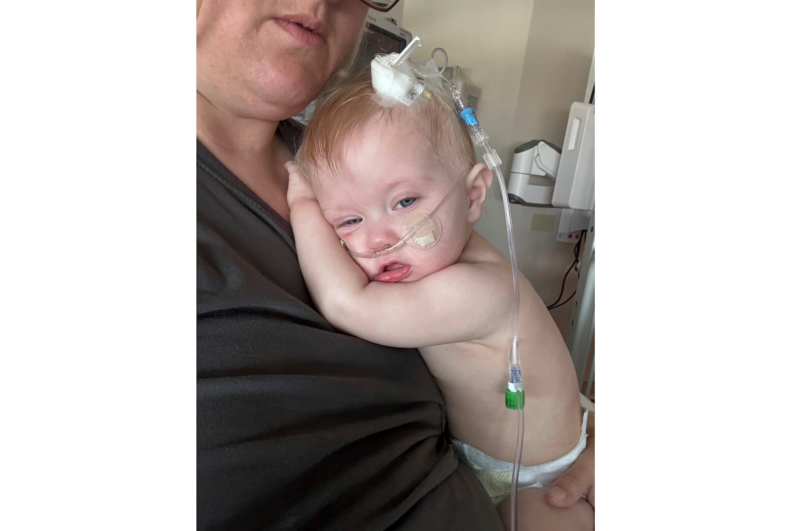 This image provided by Nicole West shows Logan West, 11 months old, of Townsend, Mont., who was sickened in October in an outbreak of E. coli food poisoning tied to slivered onions served on McDonald's Quarter Pounder hamburgers. (Nicole West via AP)