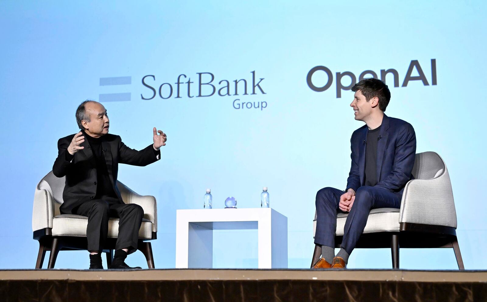 SoftBank Chief Masayoshi Son, left, and OpenAI Chief Sam Altman hold a talk during an event for enterprises in Tokyo, in Tokyo, Monday, Feb. 3, 2025. (Kyodo News via AP)