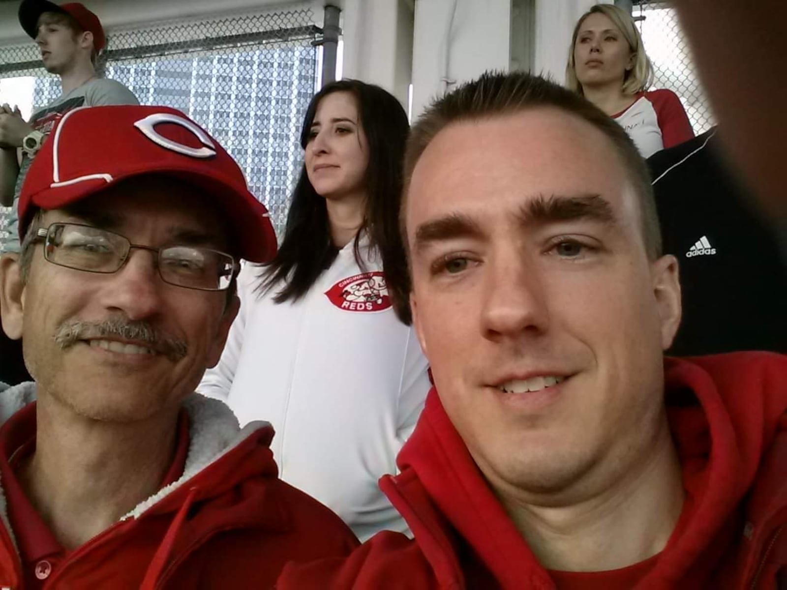 Larry Lykins and his son, Chris, attended a Reds Opening Game in 2015 and will be at Great American Ball Park today when the Reds play the Cleveland Guardians. SUBMITTED PHOTO