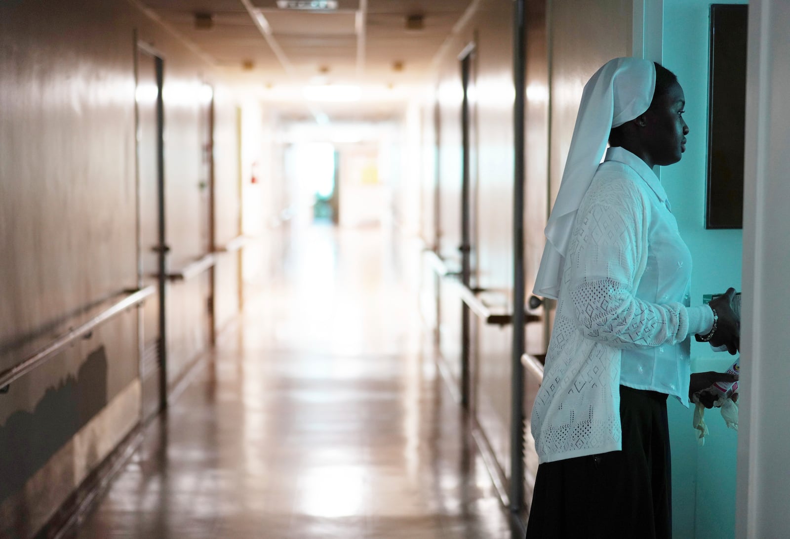 Sister Seyram Mary Adzokpa makes her morning rounds caring for the elderly sisters at the motherhouse of the Sisters of the Holy Family in New Orleans, Wednesday, June 26, 2024. (AP Photo/Jessie Wardarski)