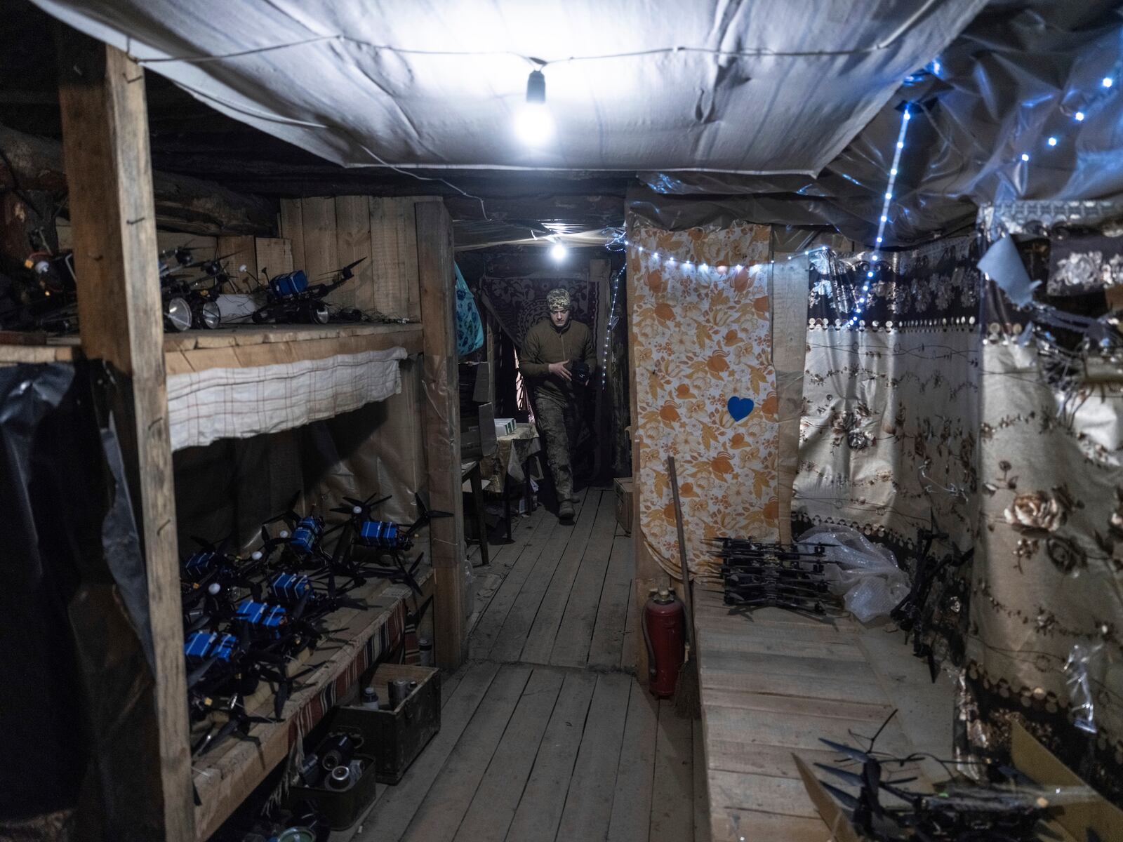 In this photo provided by Ukraine's 93rd Kholodnyi Yar Separate Mechanized Brigade press service, a soldier in a shelter gets ready to fire FPV drones towards Russian positions in a shelter in Kramatorsk direction, Donetsk region, Ukraine, Saturday, March 22, 2025. (Iryna Rybakova/Ukraine's 93rd Mechanized Brigade via AP)