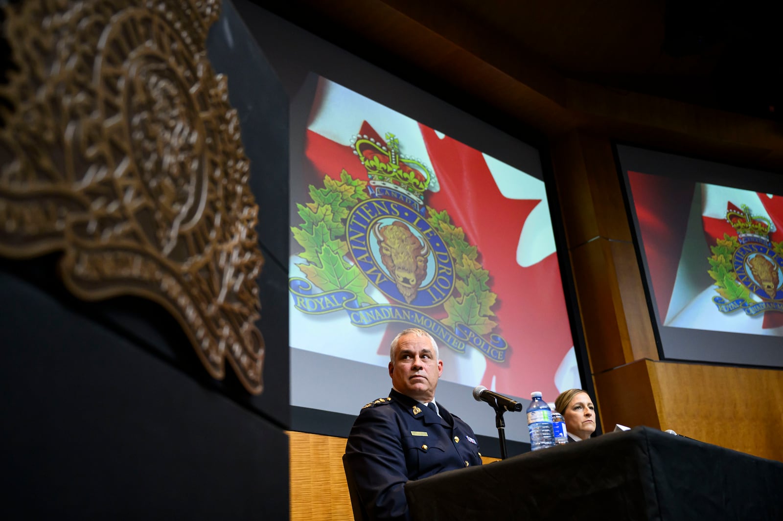 RCMP Commissioner Mike Duheme, left, and Assistant Commissioner Brigitte Gauvin participate in a news conference at RCMP National Headquarters in Ottawa, Ontaio, Monday, Oct. 14, 2024. (Justin Tang/The Canadian Press via AP)