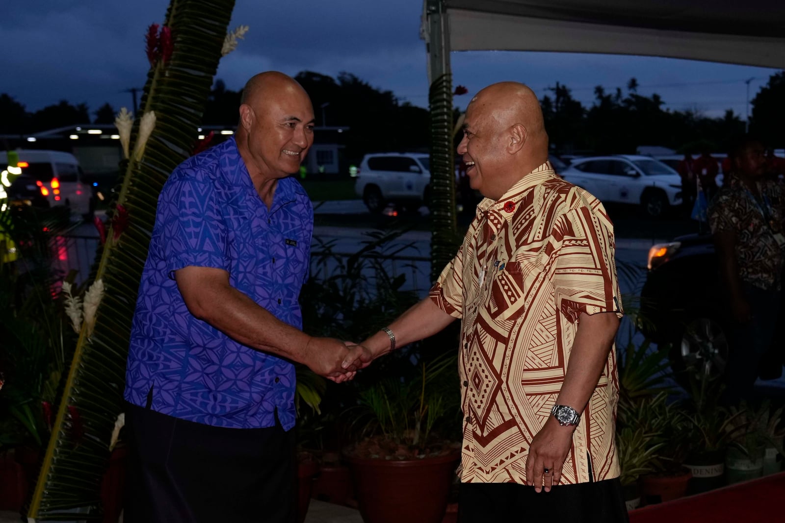 Samoan Deputy Prime Minister Tuala Iosefo Ponifasio, left, welcomes Prime Minister of Tuvalu Feleti Teo to the official welcome reception for the Commonwealth Heads of Government meeting in Apia, Samoa, Thursday, Oct. 24, 2024. (AP Photo/Rick Rycroft/Pool)