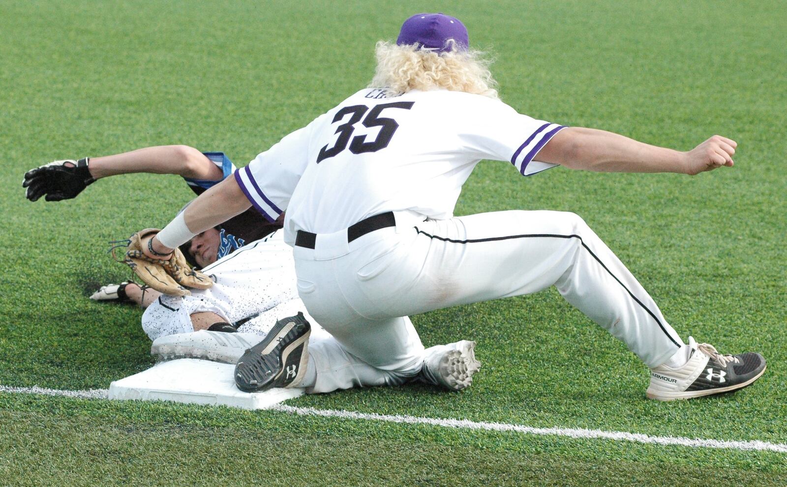 Cincinnati Christian’s Tim Carangi is tagged out by Cincinnati Hills Christian Academy’s Lucas Rotello at third base Thursday during a Miami Valley Conference baseball game at Prasco Park’s Legacy Field in Mason. CHCA won 3-2. RICK CASSANO/STAFF