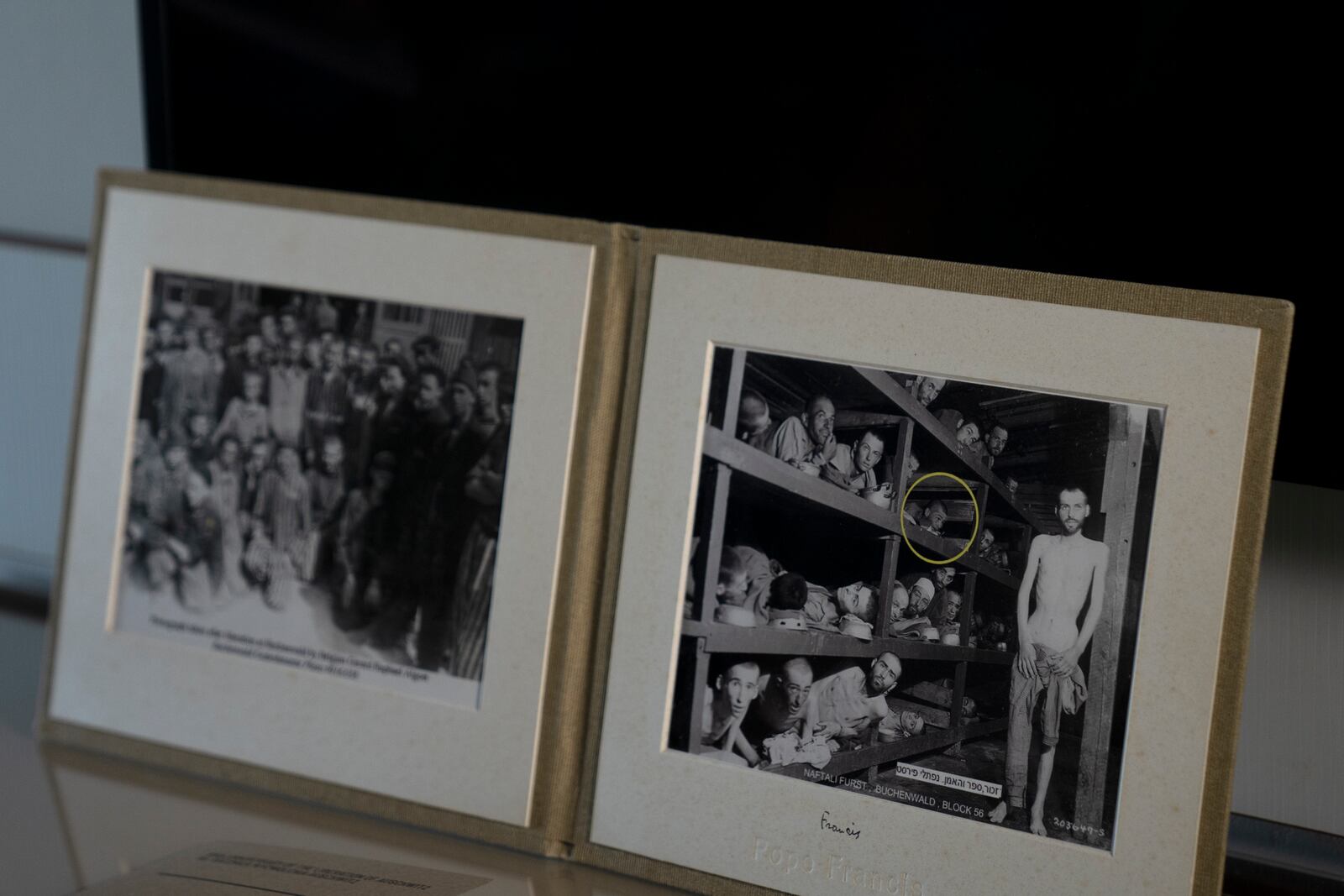 A photo of Holocaust survivor Naftali Fürst, circled in yellow, was taken by U.S. Army Pvt. H. Miller in April 1945 during the liberation of Buchenwald concentration camp, and is displayed in Fürst's home in Haifa, Israel, Tuesday, Jan. 14, 2025. (AP Photo/Maya Alleruzzo)