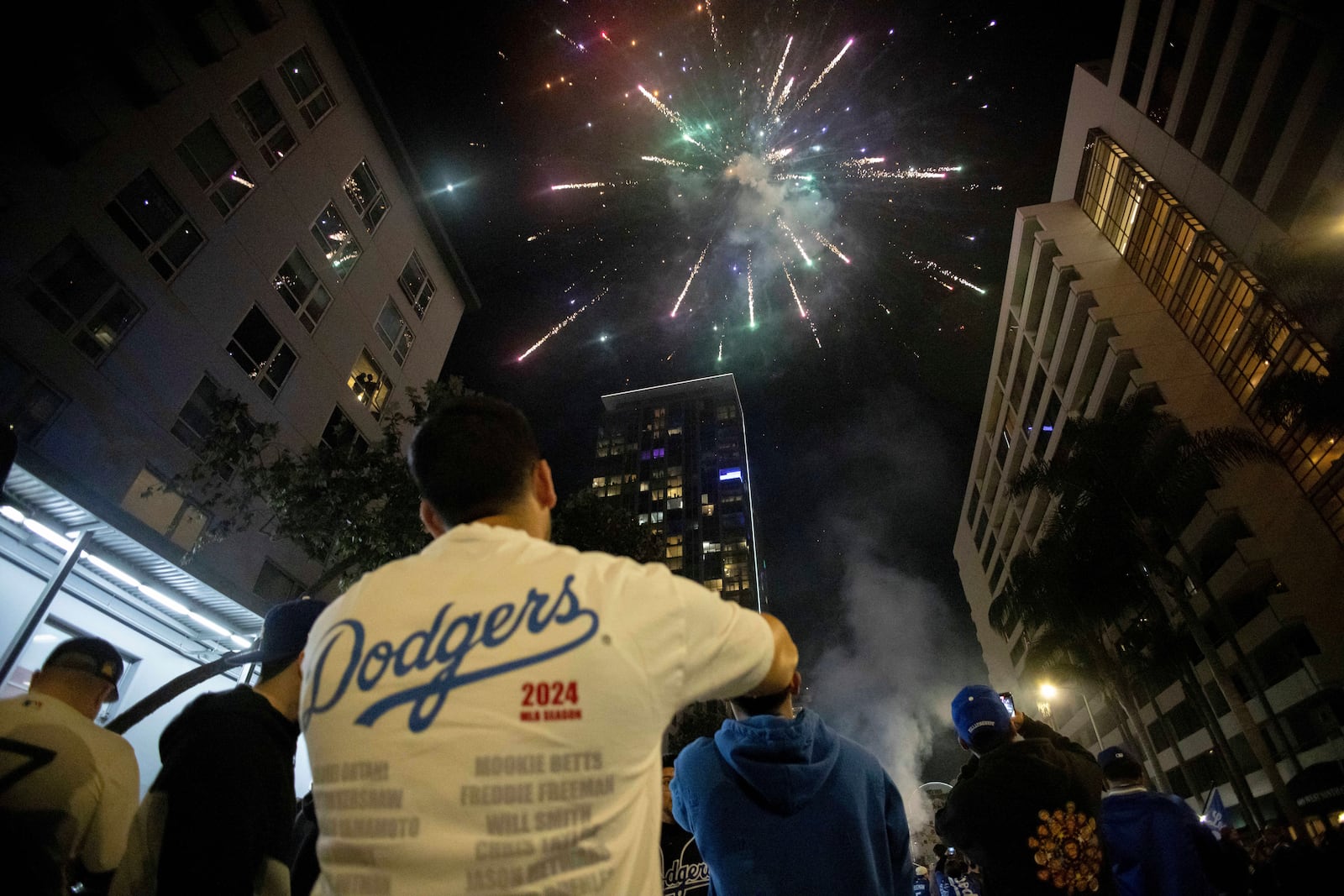 Fireworks go off as fans celebrate on the streets after the Los Angeles Dodgers defeated the New York Yankees to win the baseball World Series Wednesday, Oct. 30, 2024, in Los Angeles. (AP Photo/Ethan Swope)